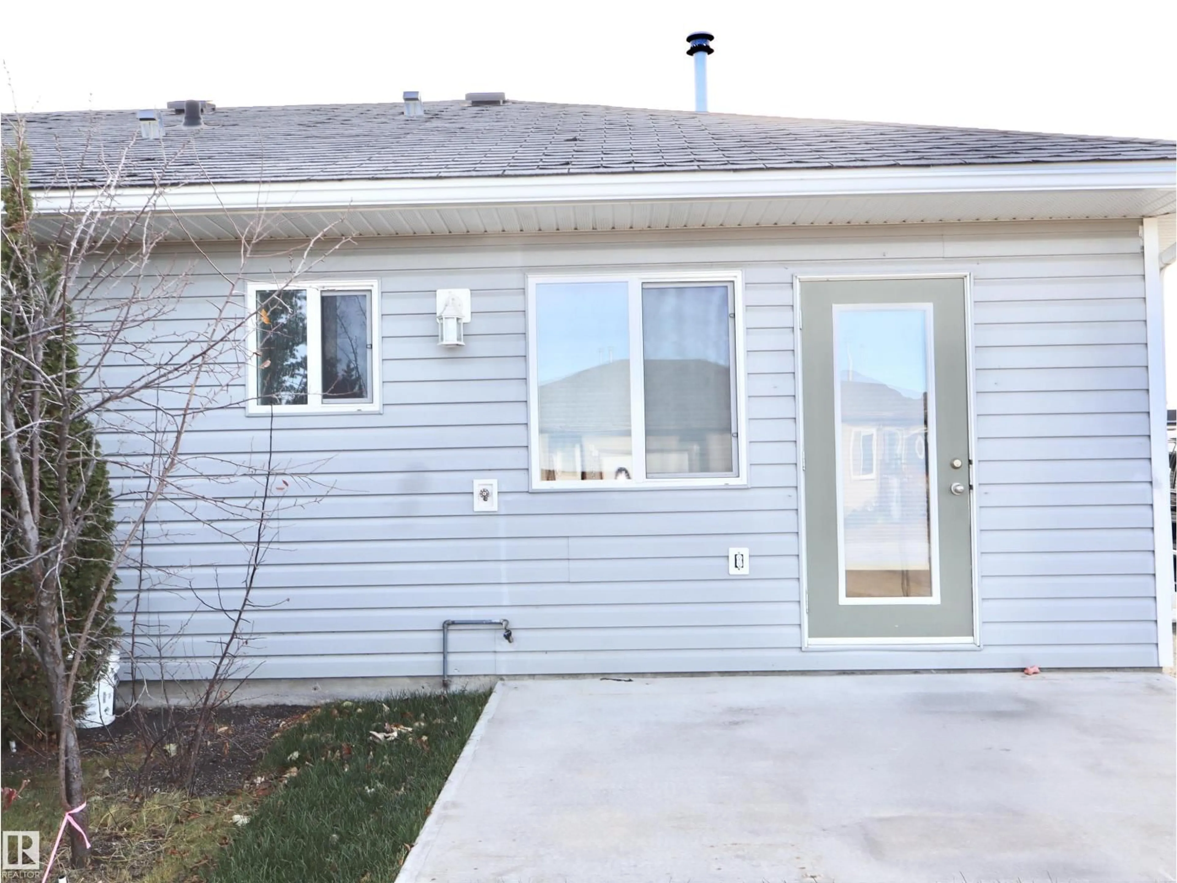 Home with vinyl exterior material, street for #7 - 5831 46 STREET, Barrhead Alberta T7N0A4