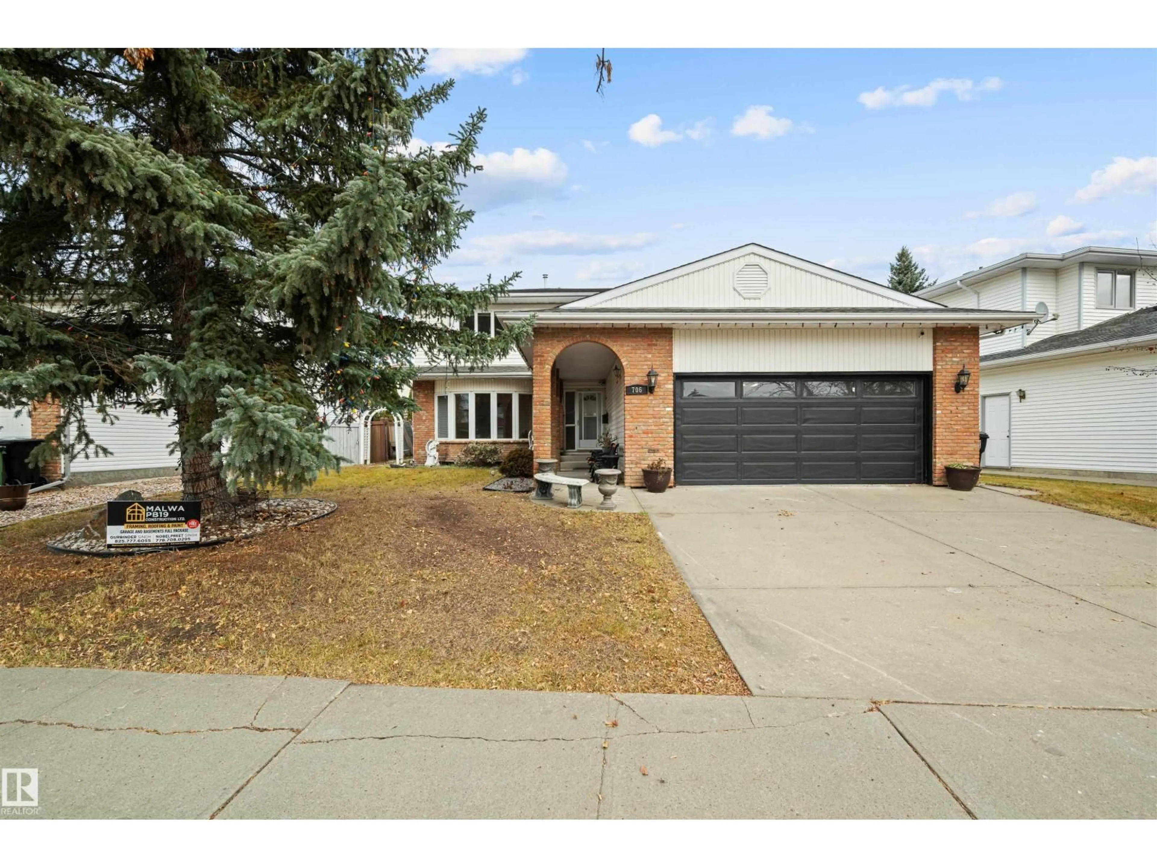Home with vinyl exterior material, street for 706 BURLEY DR, Edmonton Alberta T6R1Y2