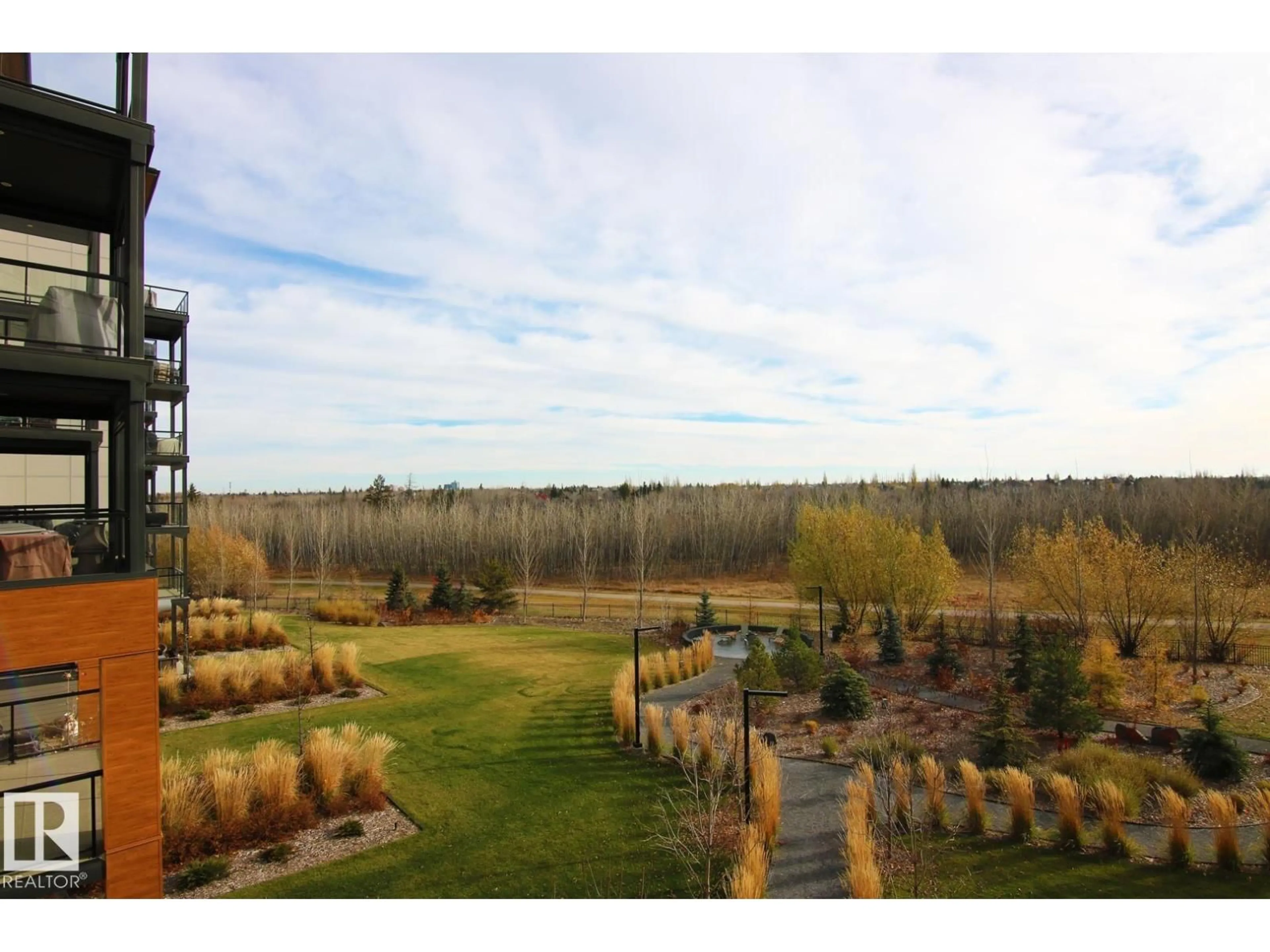 A pic from outside/outdoor area/front of a property/back of a property/a pic from drone, forest/trees view for #311 - 7463 MAY CM, Edmonton Alberta T6R0X1