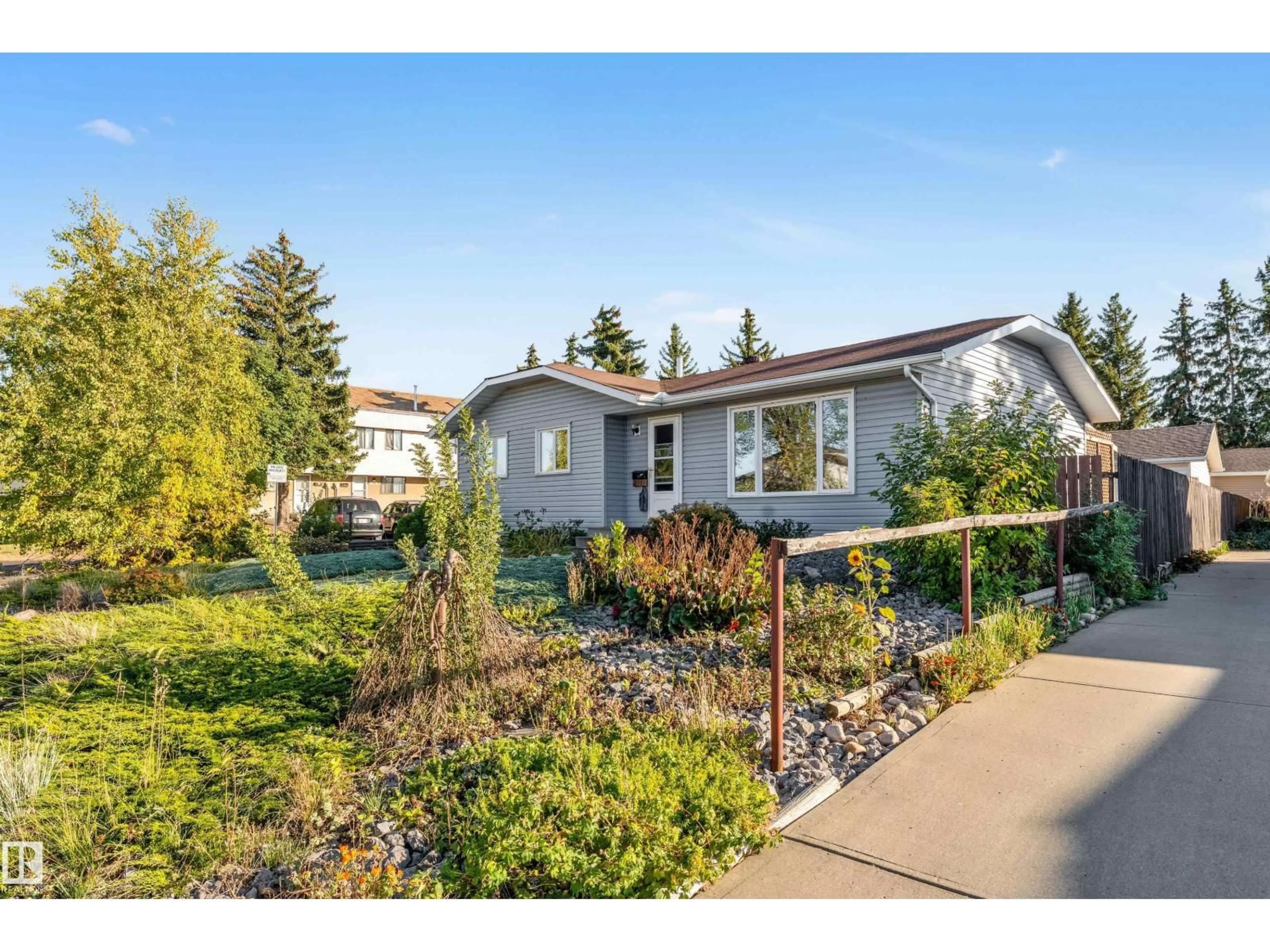 Home with vinyl exterior material, street for 8103 14 AV, Edmonton Alberta T6K1X3