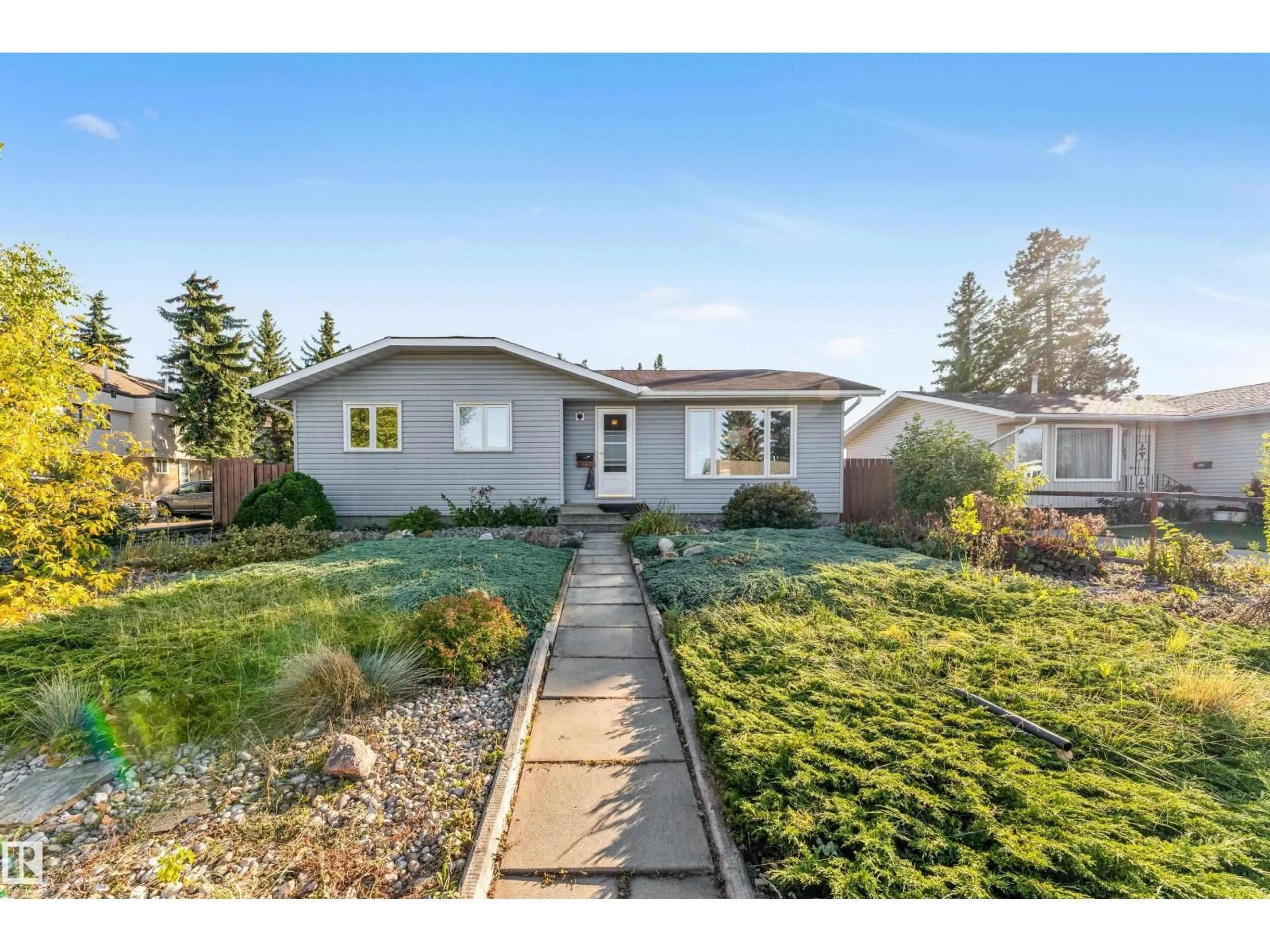 Home with vinyl exterior material, street for 8103 14 AV, Edmonton Alberta T6K1X3