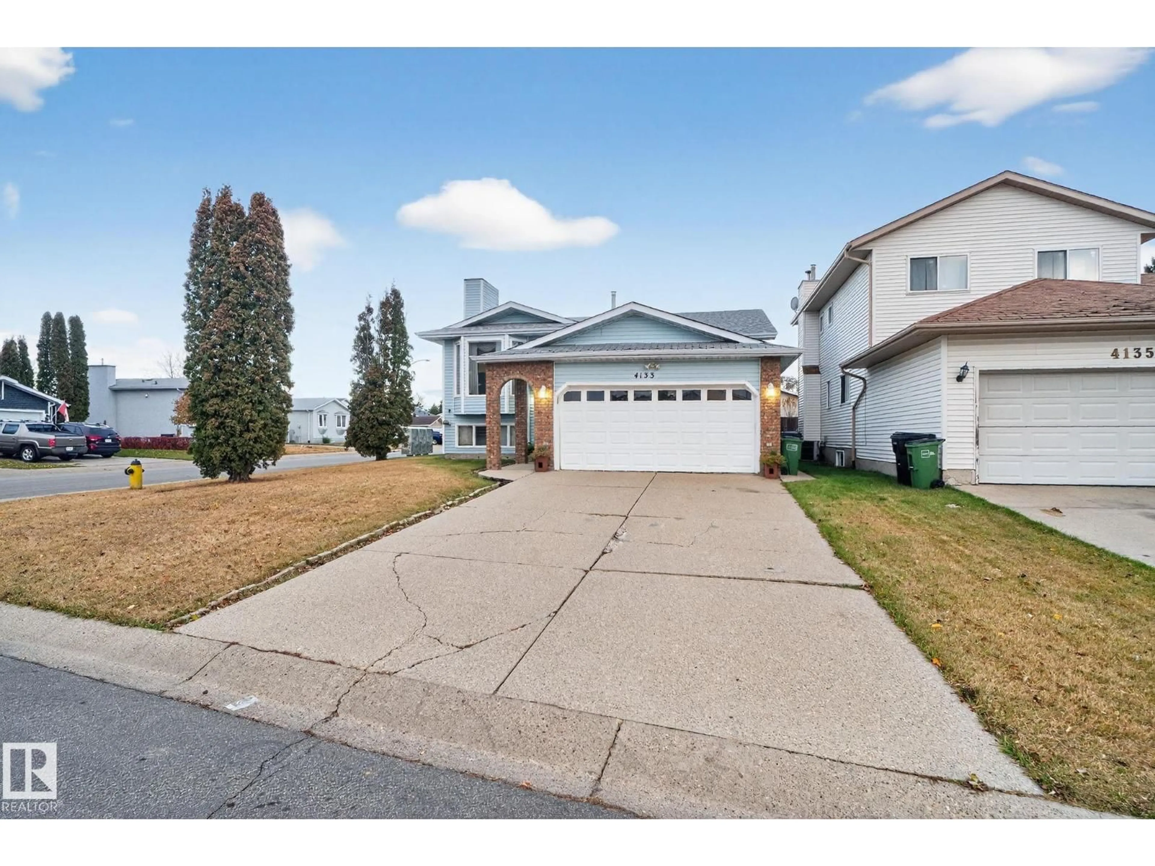 Home with vinyl exterior material, street for 4133 28 AV, Edmonton Alberta T6L4H2