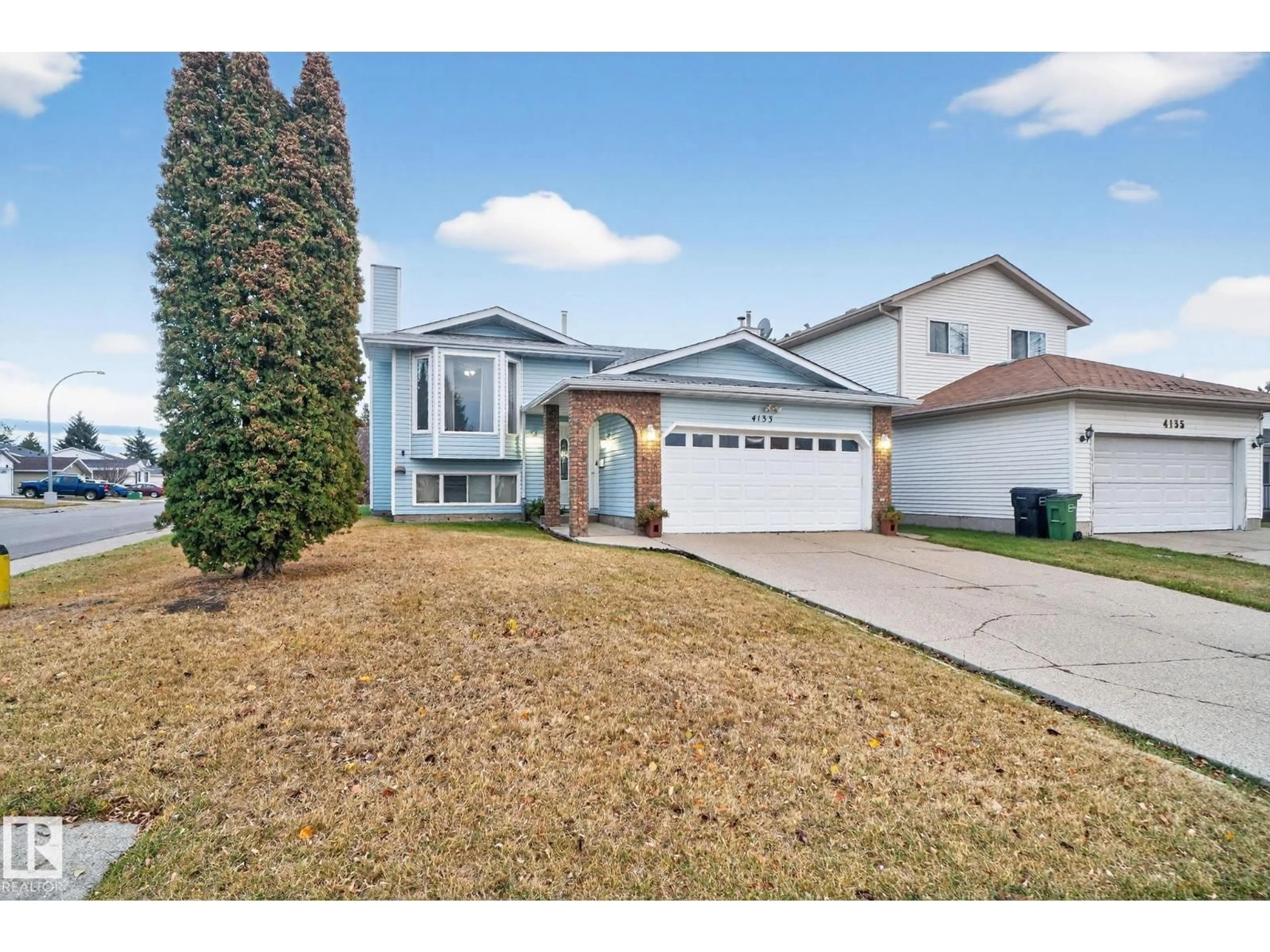 Home with vinyl exterior material, street for 4133 28 AV, Edmonton Alberta T6L4H2