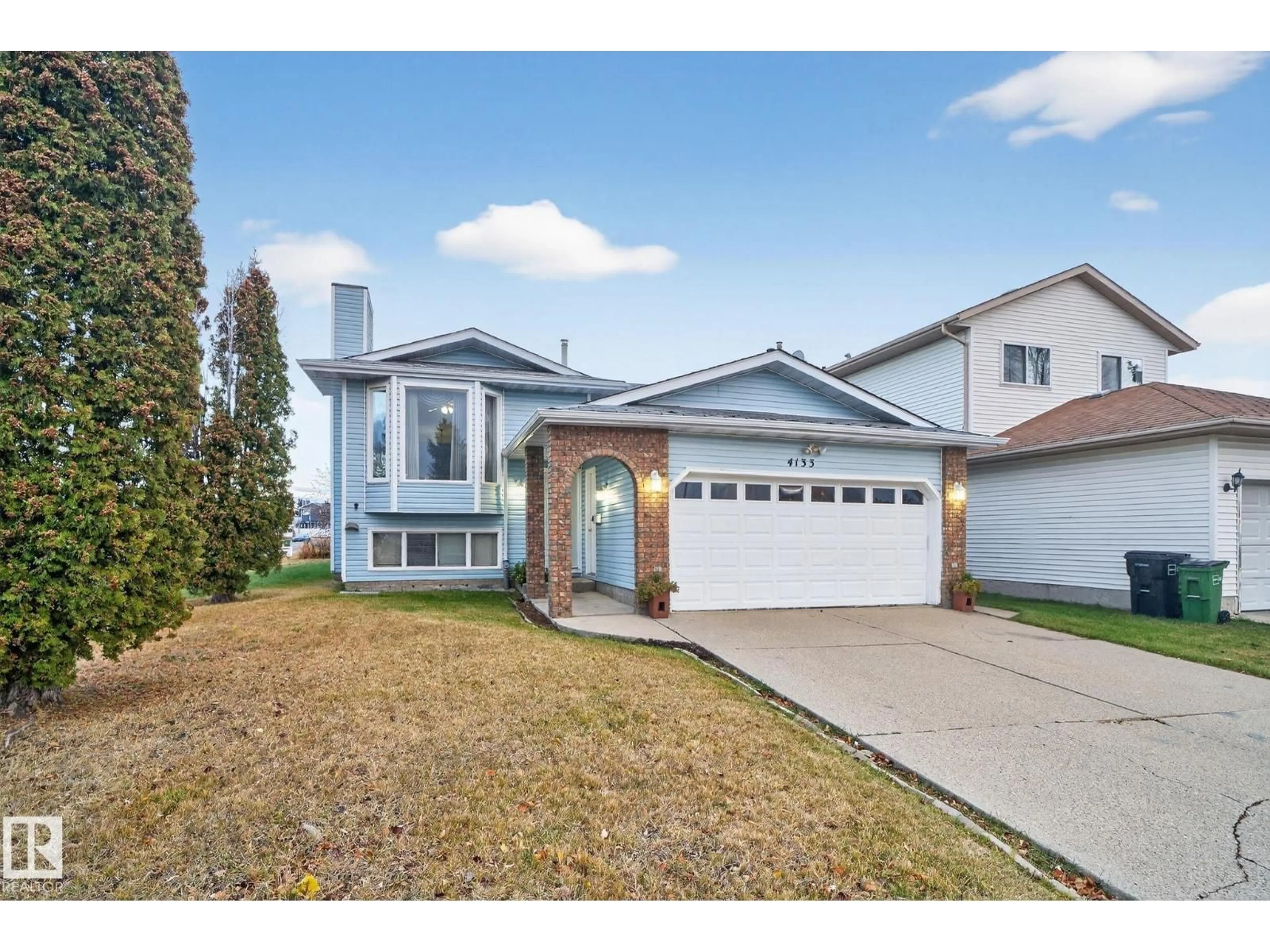 Home with vinyl exterior material, street for 4133 28 AV, Edmonton Alberta T6L4H2