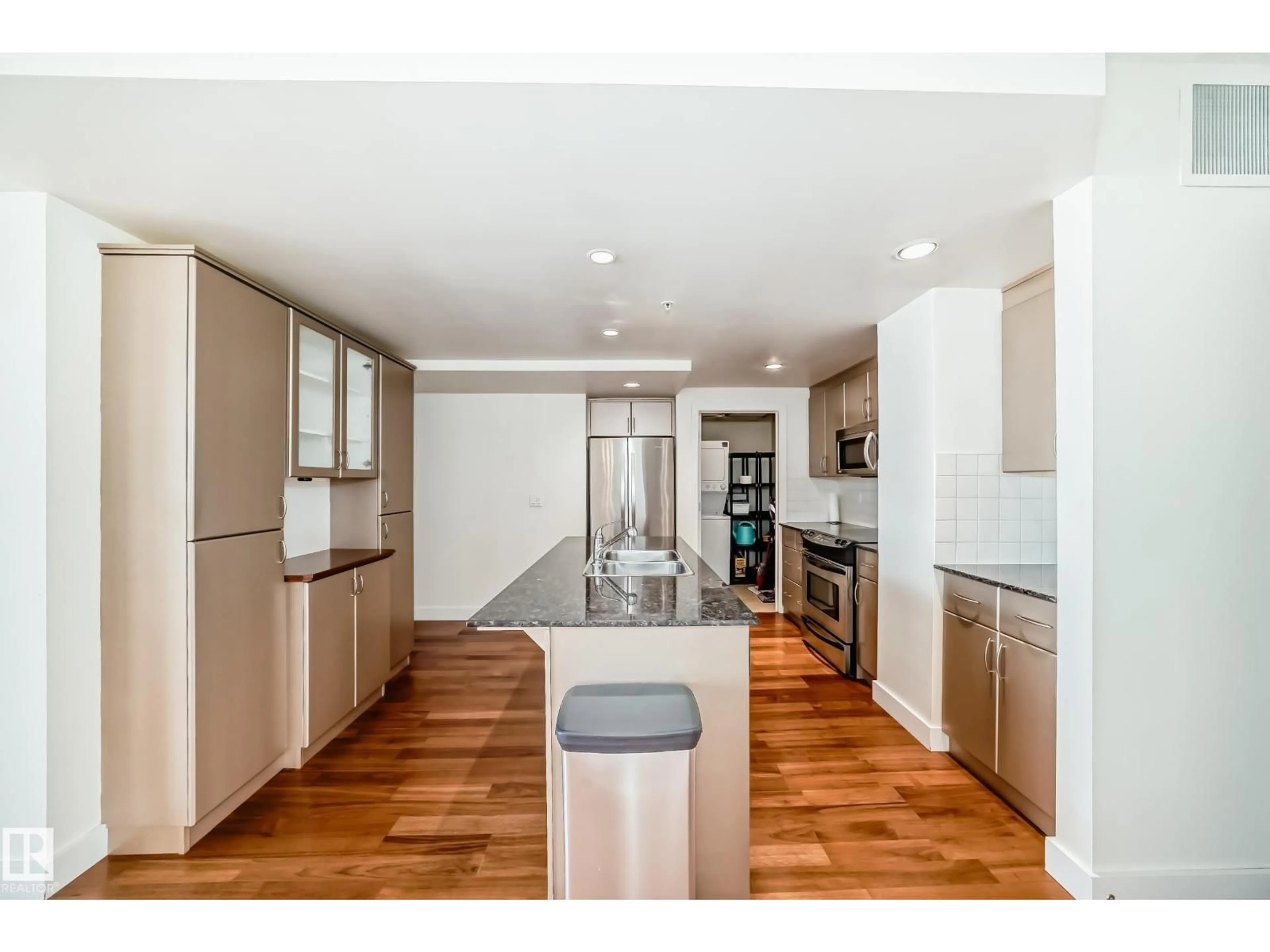 Open concept kitchen, wood/laminate floor for #703 - 10028 119 ST, Edmonton Alberta T5K1Y8