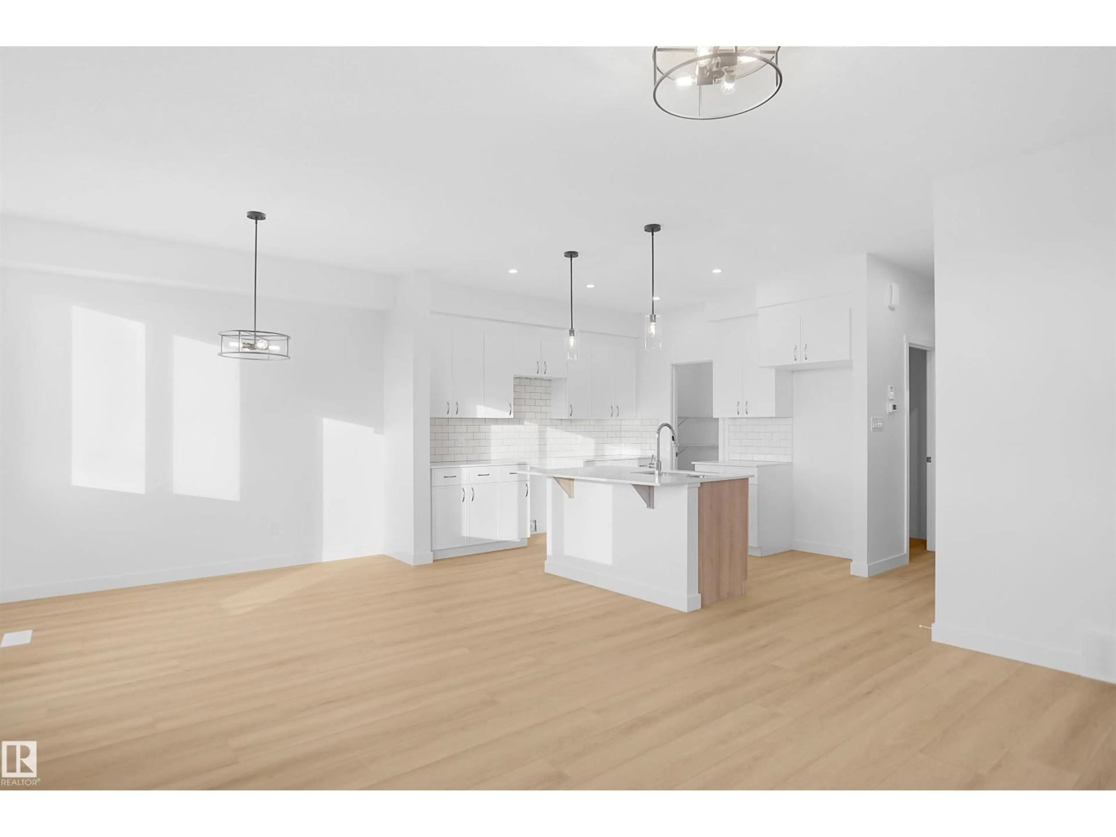 Open concept kitchen, wood/laminate floor for 3436 122 ST, Edmonton Alberta T6W5M9