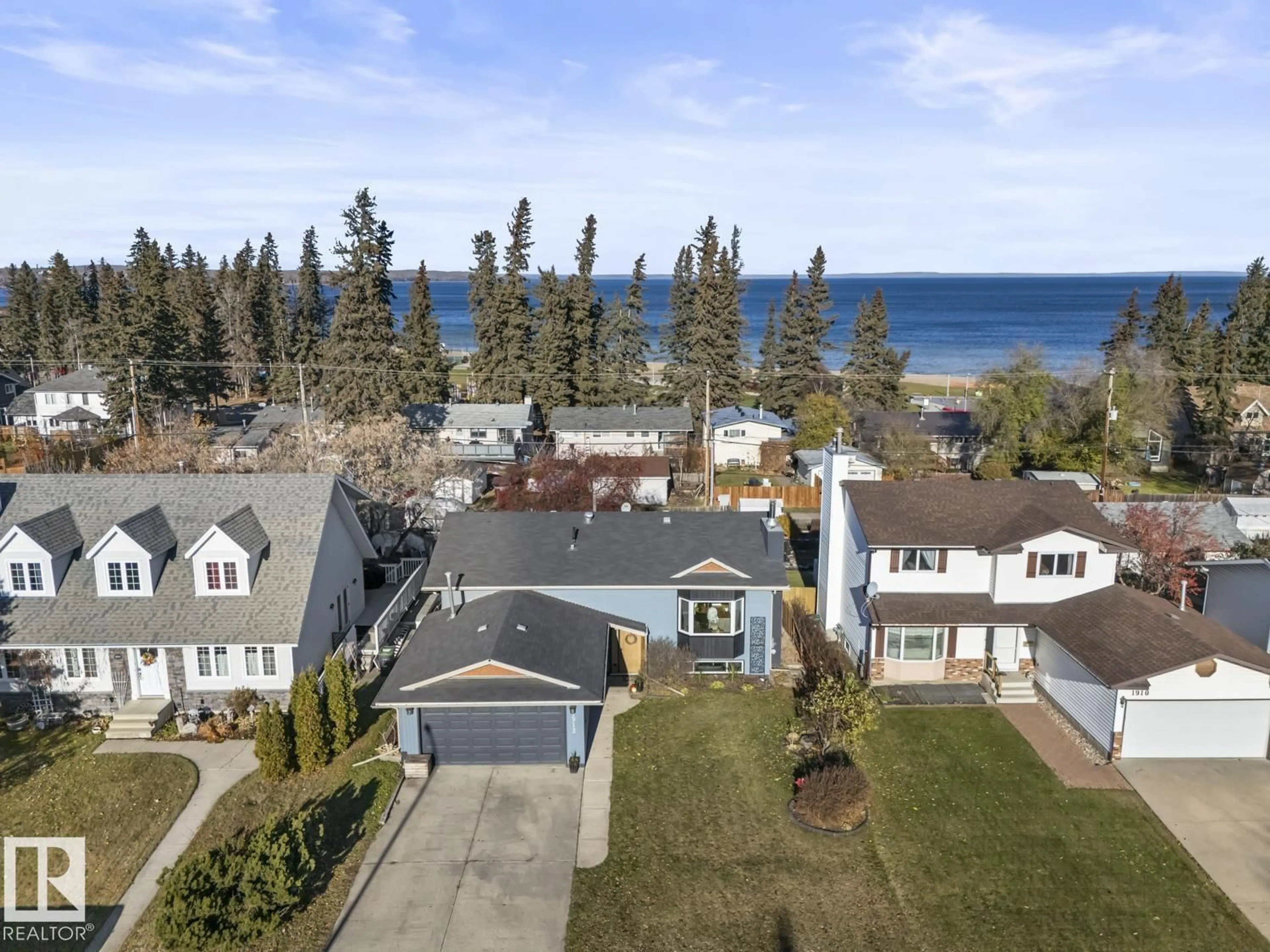A pic from outside/outdoor area/front of a property/back of a property/a pic from drone, water/lake/river/ocean view for 1912 2 AV, Cold Lake Alberta T9M1E3