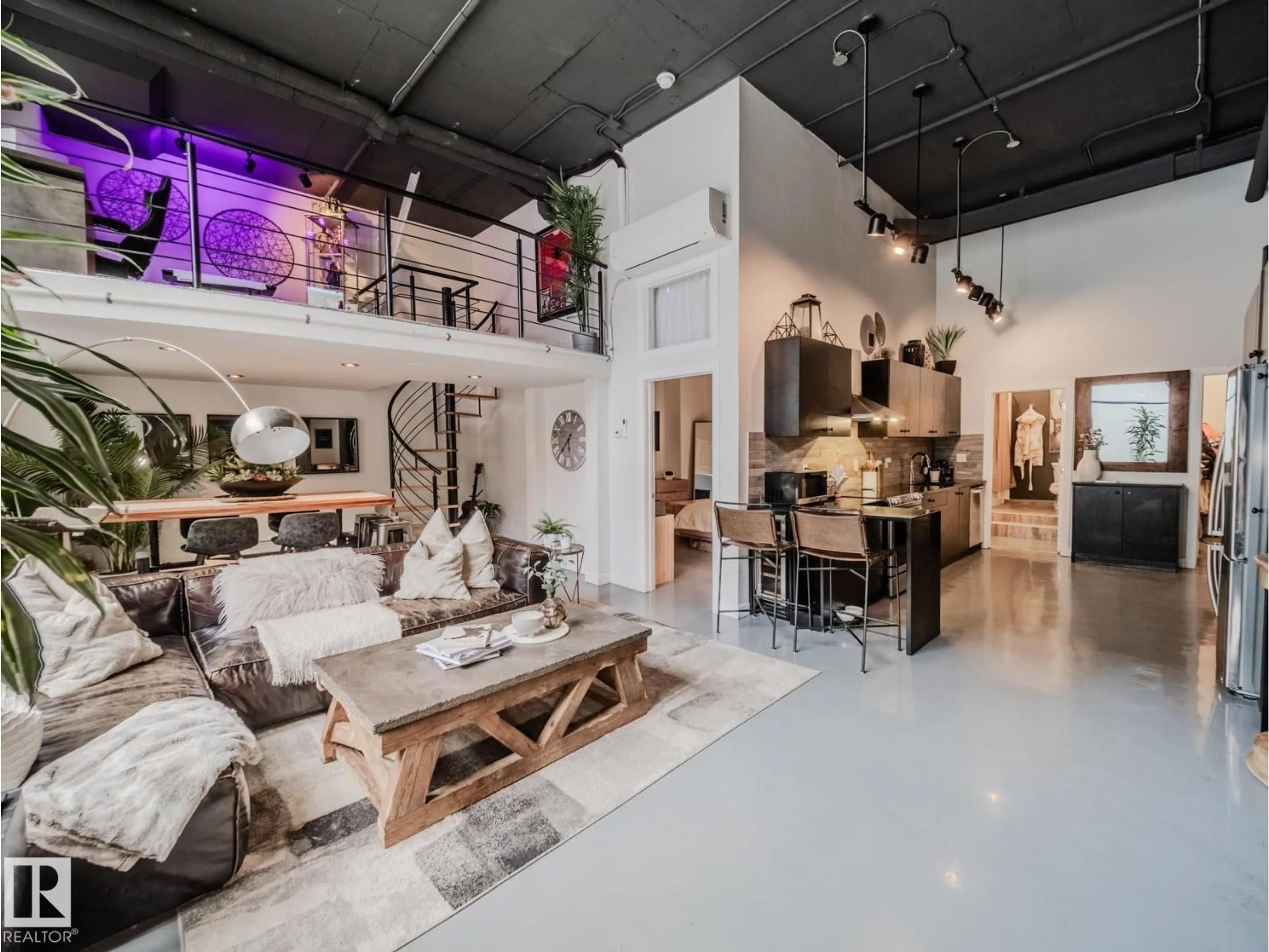 Living room with furniture, cement floor for 1001 10179 105 ST NW, Edmonton Alberta T5J3N1