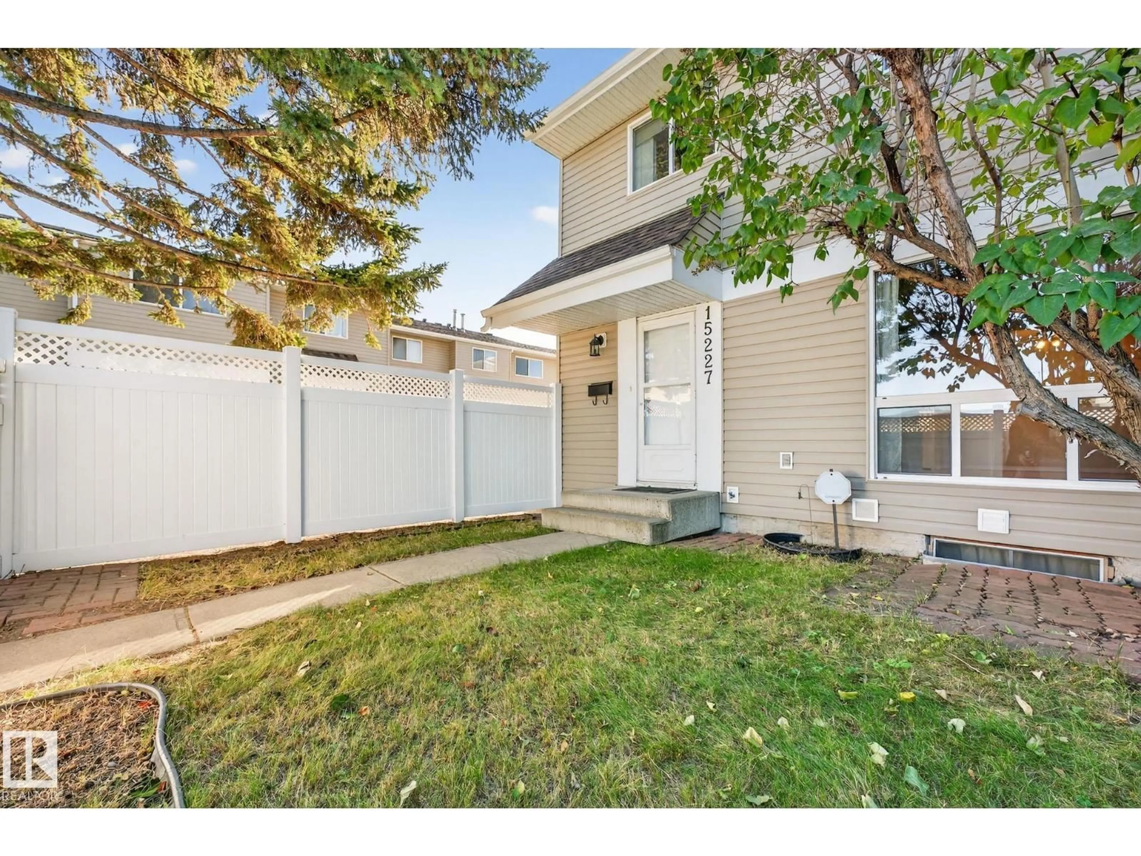 Home with vinyl exterior material, street for NW - 15227 54 ST, Edmonton Alberta T5A3N9