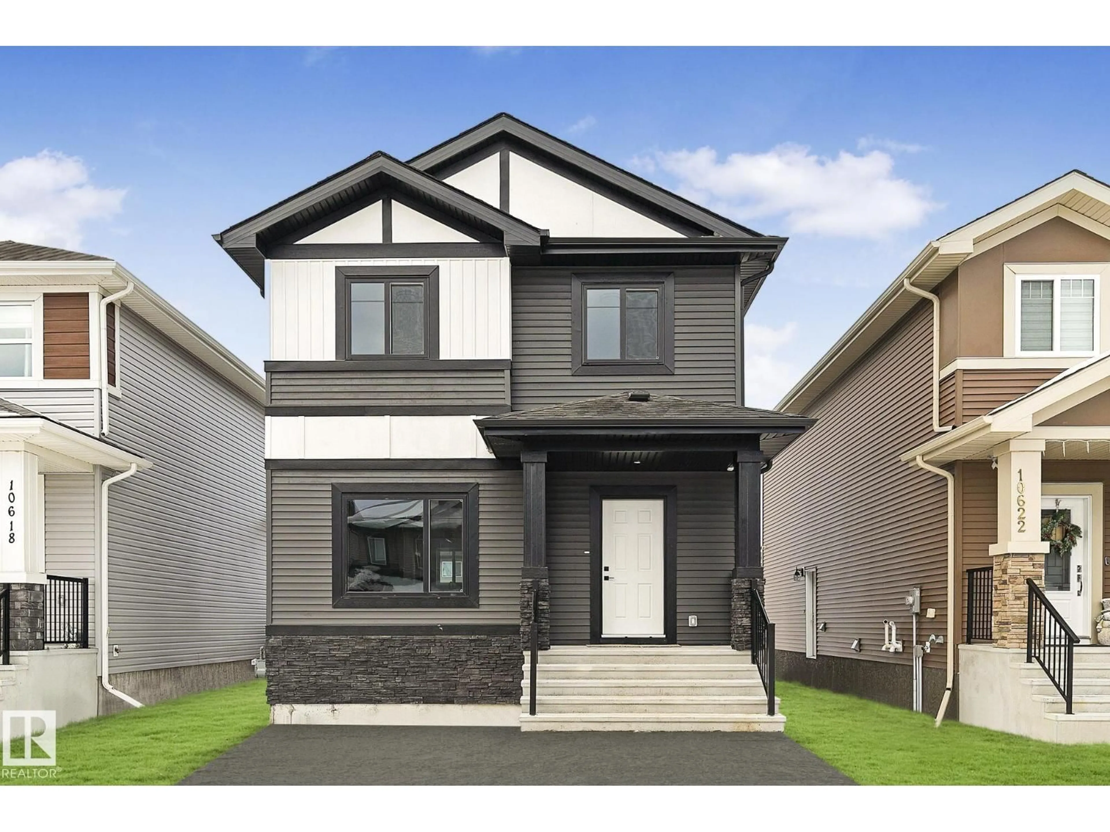 Home with vinyl exterior material, street for 9825 107A AV, Morinville Alberta T8R2P2