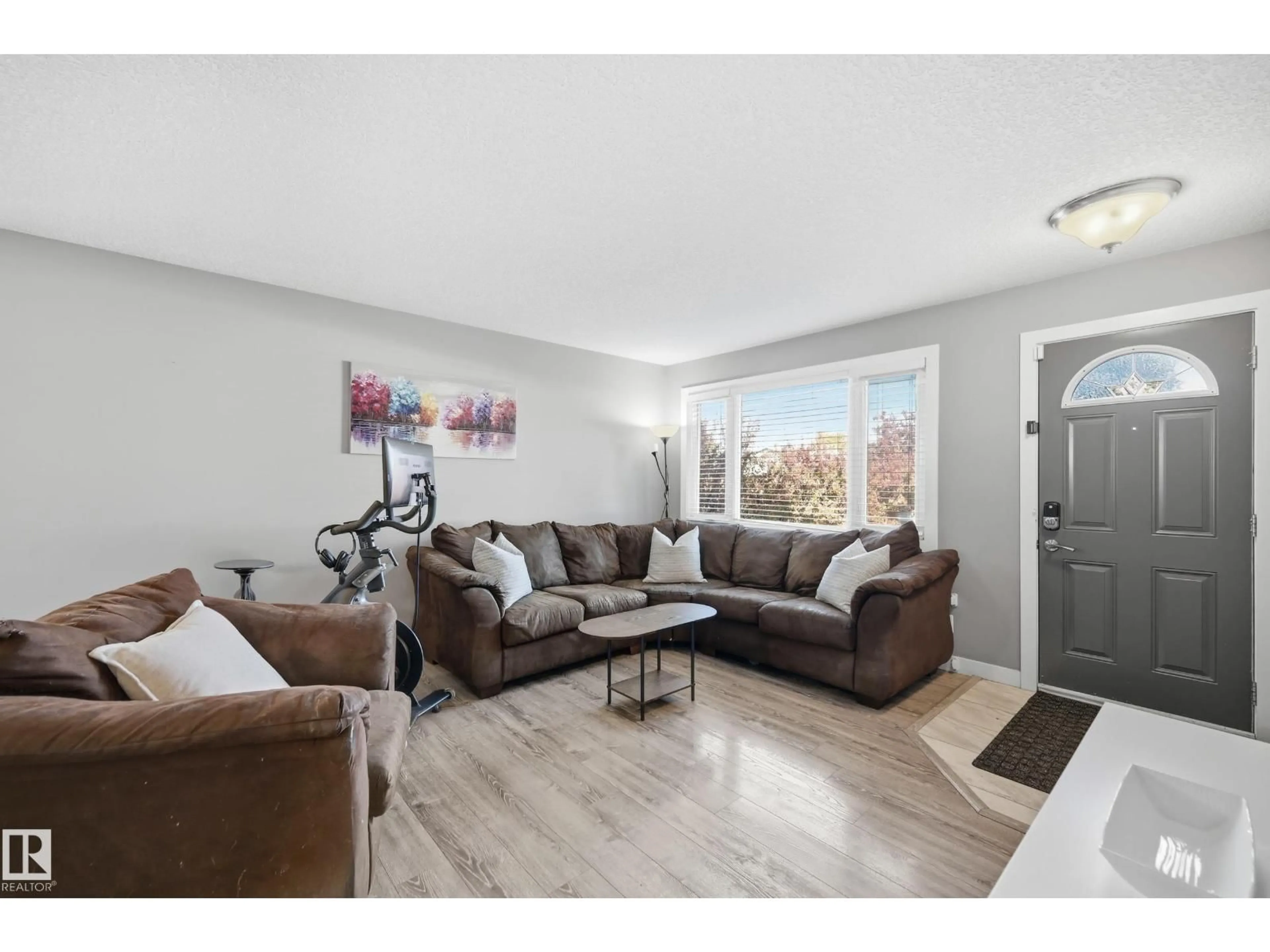 Living room with furniture, unknown for 8015 130 AV, Edmonton Alberta T5C1Y6