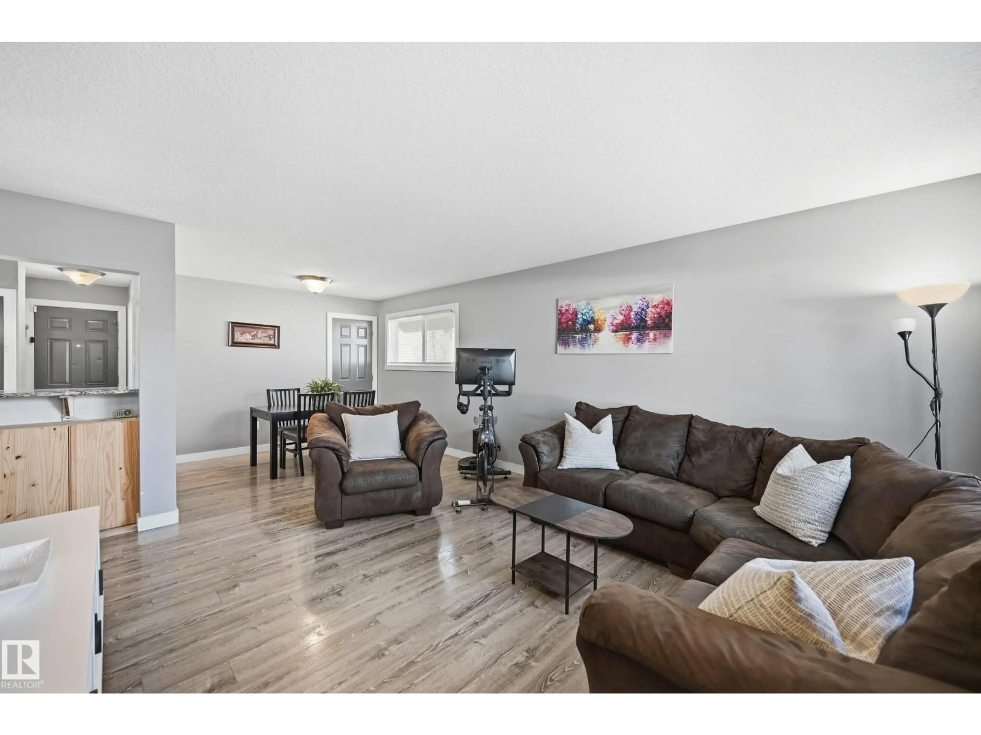 Living room with furniture, wood/laminate floor for 8015 130 AV, Edmonton Alberta T5C1Y6