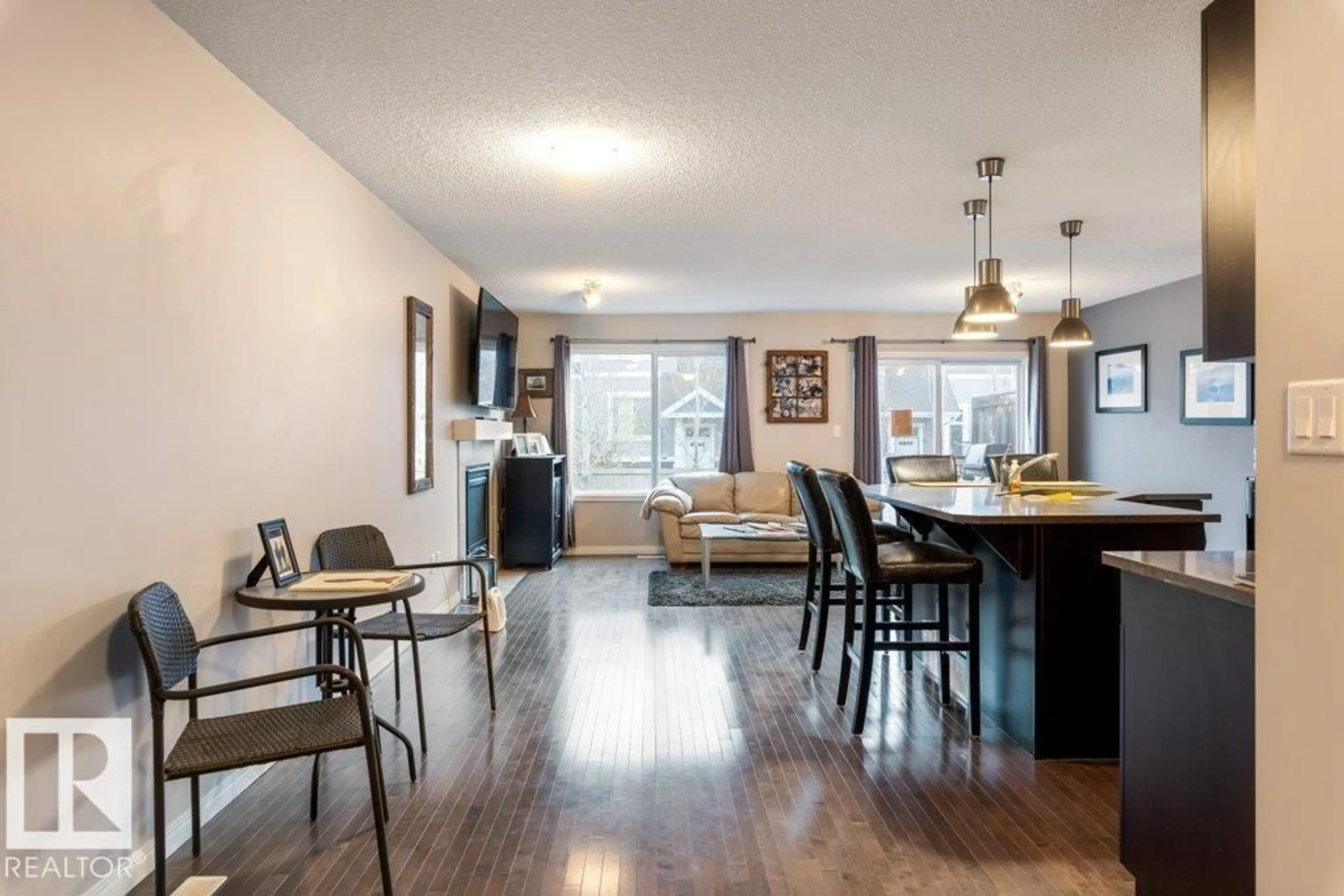 Open concept kitchen, wood/laminate floor for 1927 CHAPMAN RD, Edmonton Alberta T6W0Y7