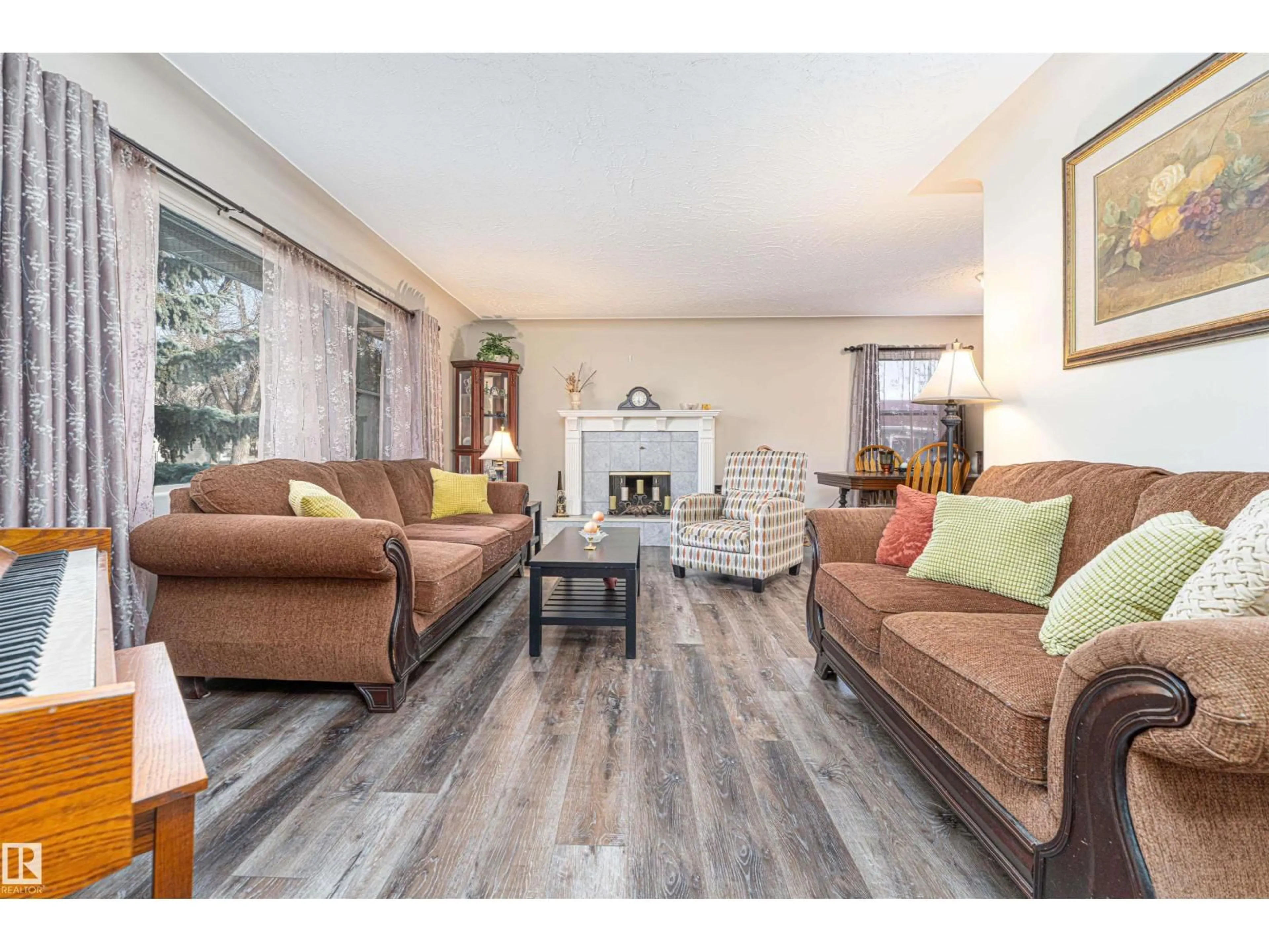 Living room with furniture, wood/laminate floor for 19 LOWE AV, Fort Saskatchewan Alberta T8L2K9