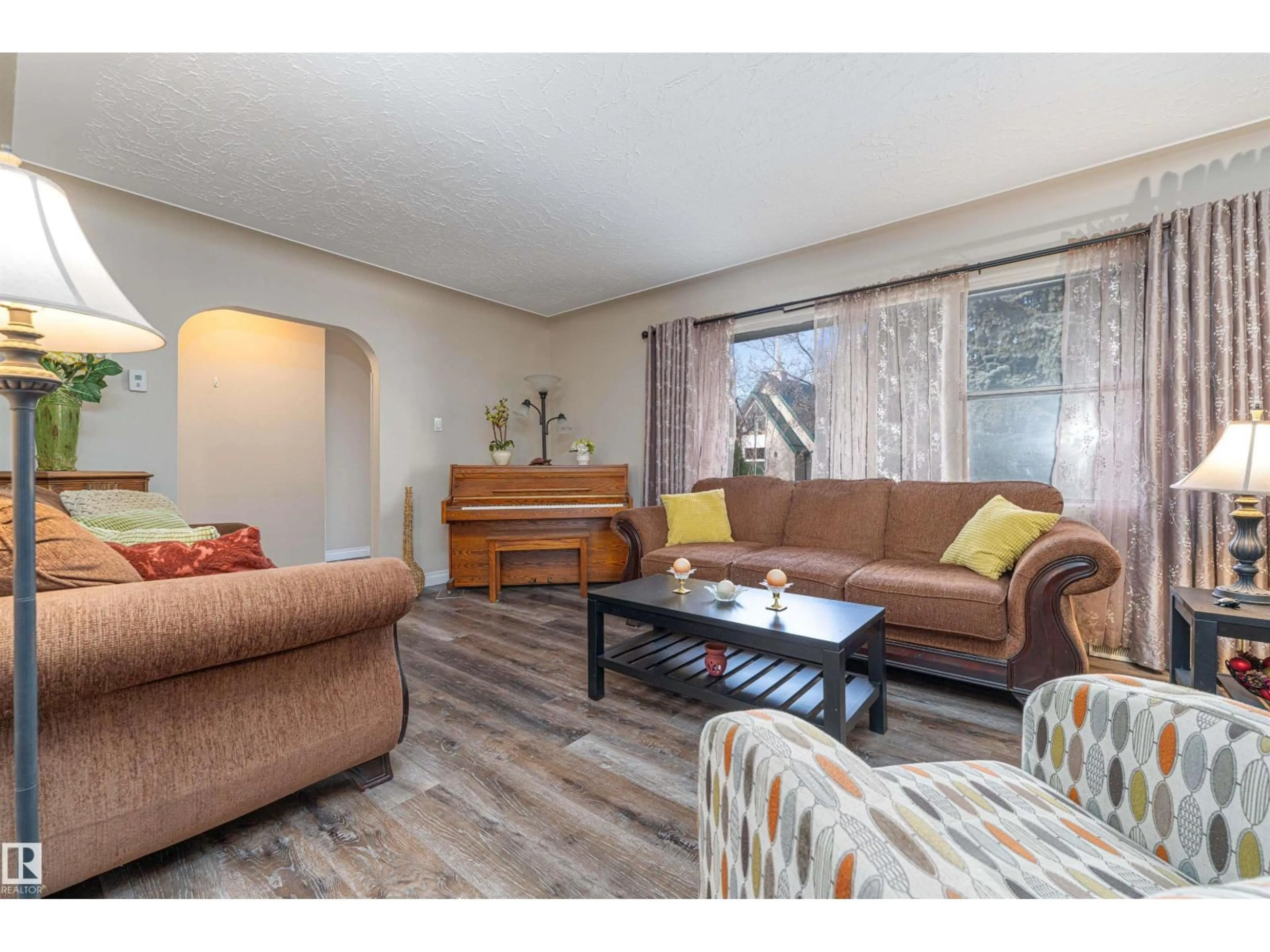 Living room with furniture, wood/laminate floor for 19 LOWE AV, Fort Saskatchewan Alberta T8L2K9