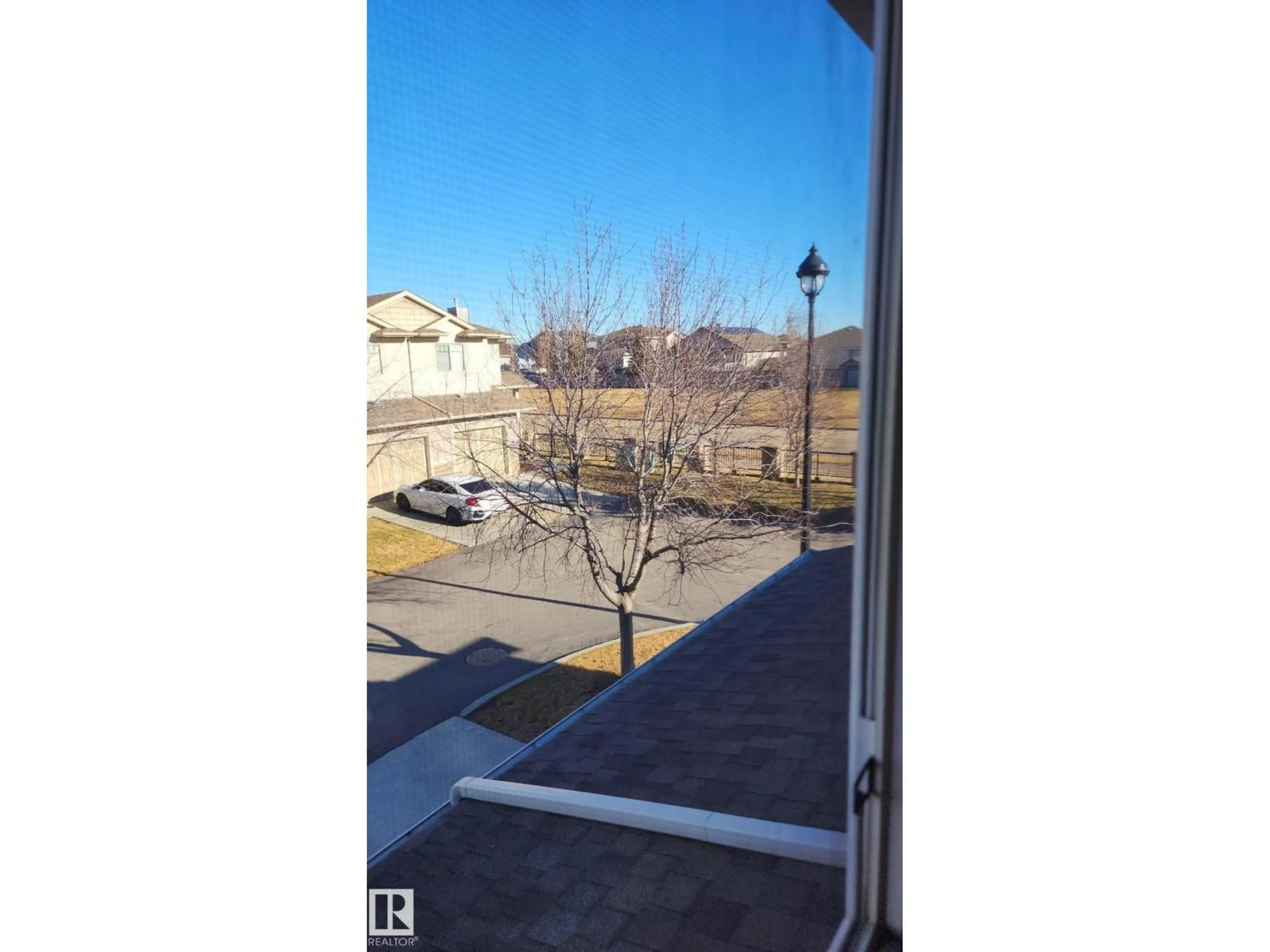 Balcony in the apartment, city buildings view from balcony for #107 - 5420 GRANT MACEWAN BV, Leduc Alberta T9E0M1