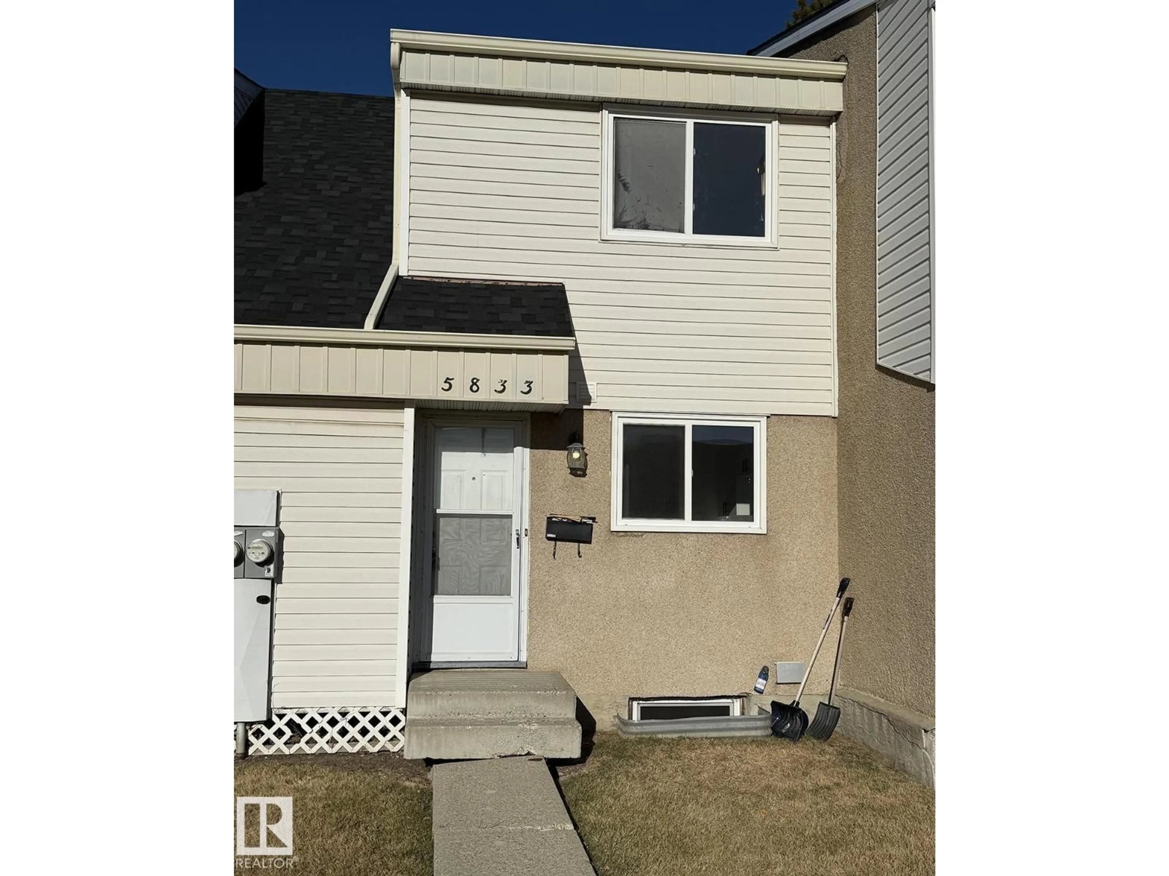Home with vinyl exterior material, street for 5833 RIVERBEND RD, Edmonton Alberta T6H5A8