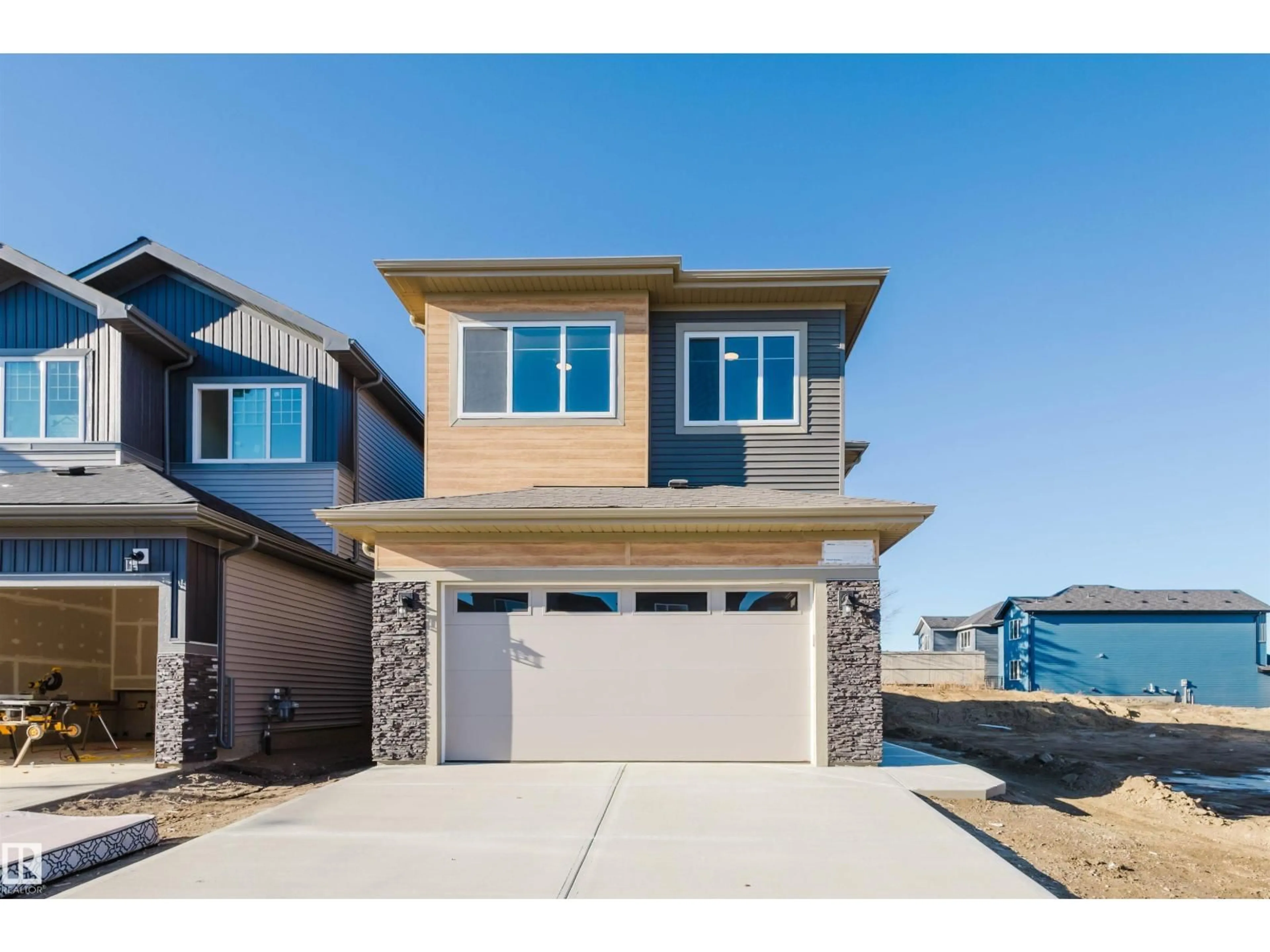 Home with vinyl exterior material, street for 1566 SISKIN LI, Edmonton Alberta T5S0V1