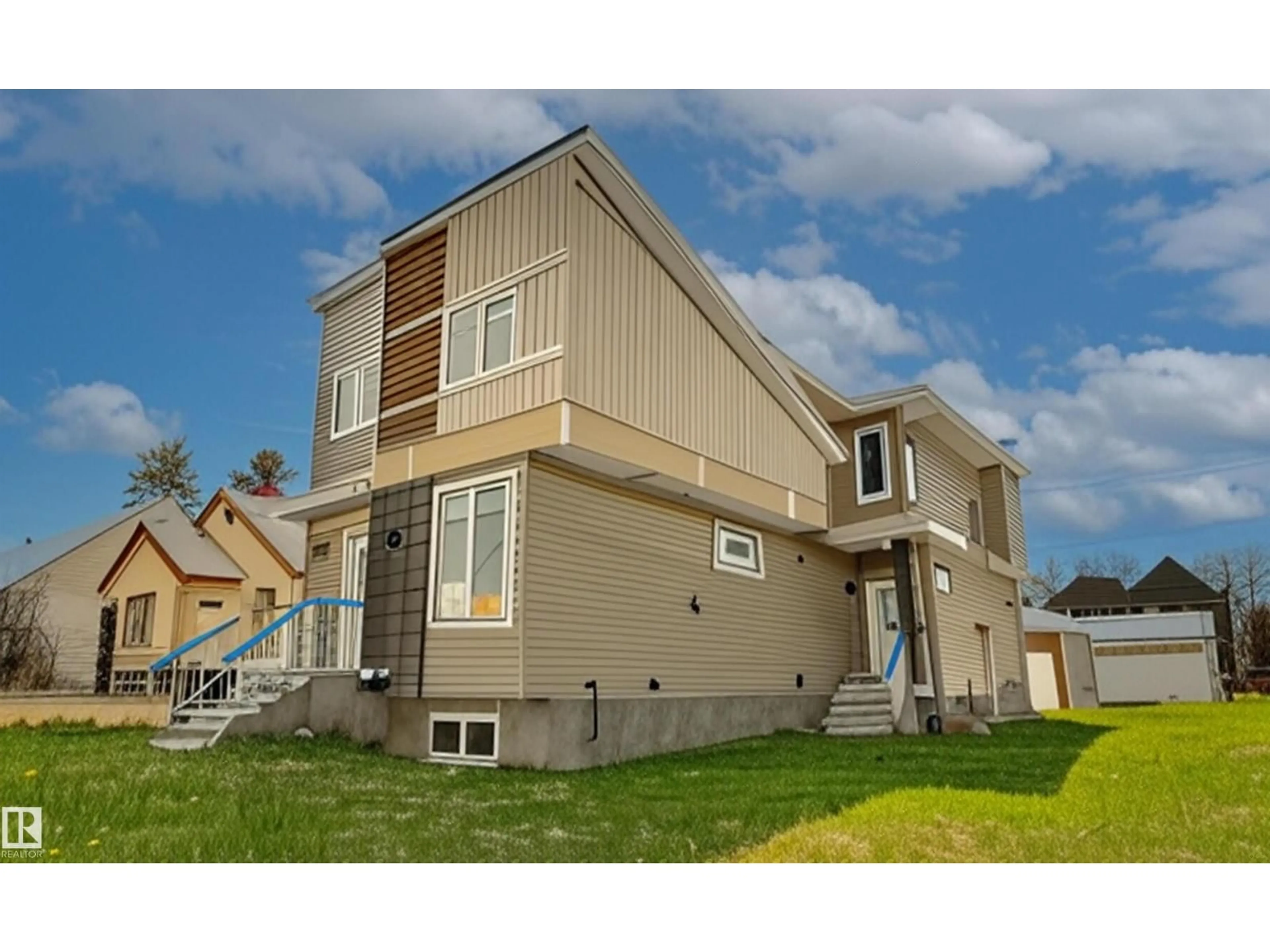 Home with vinyl exterior material, street for NW - 10446 142 ST, Edmonton Alberta T5N2P2
