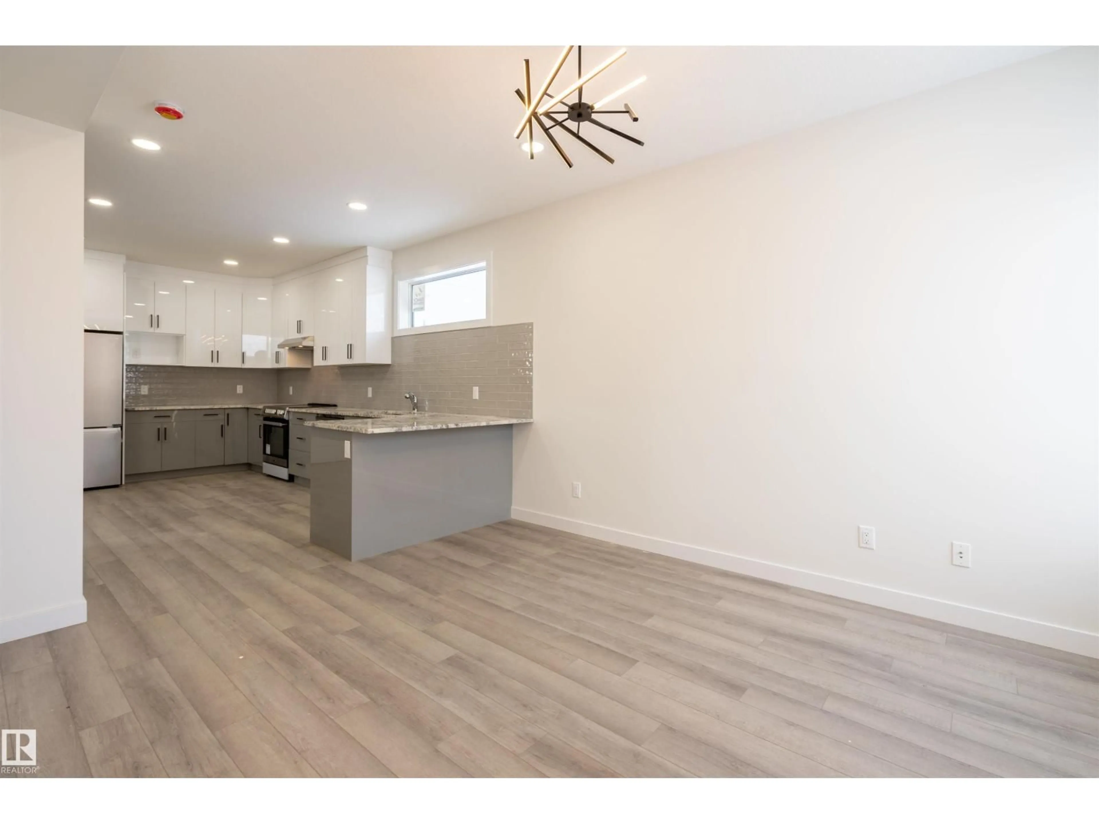 Open concept kitchen, wood/laminate floor for NW - 10446 142 ST, Edmonton Alberta T5N2P2