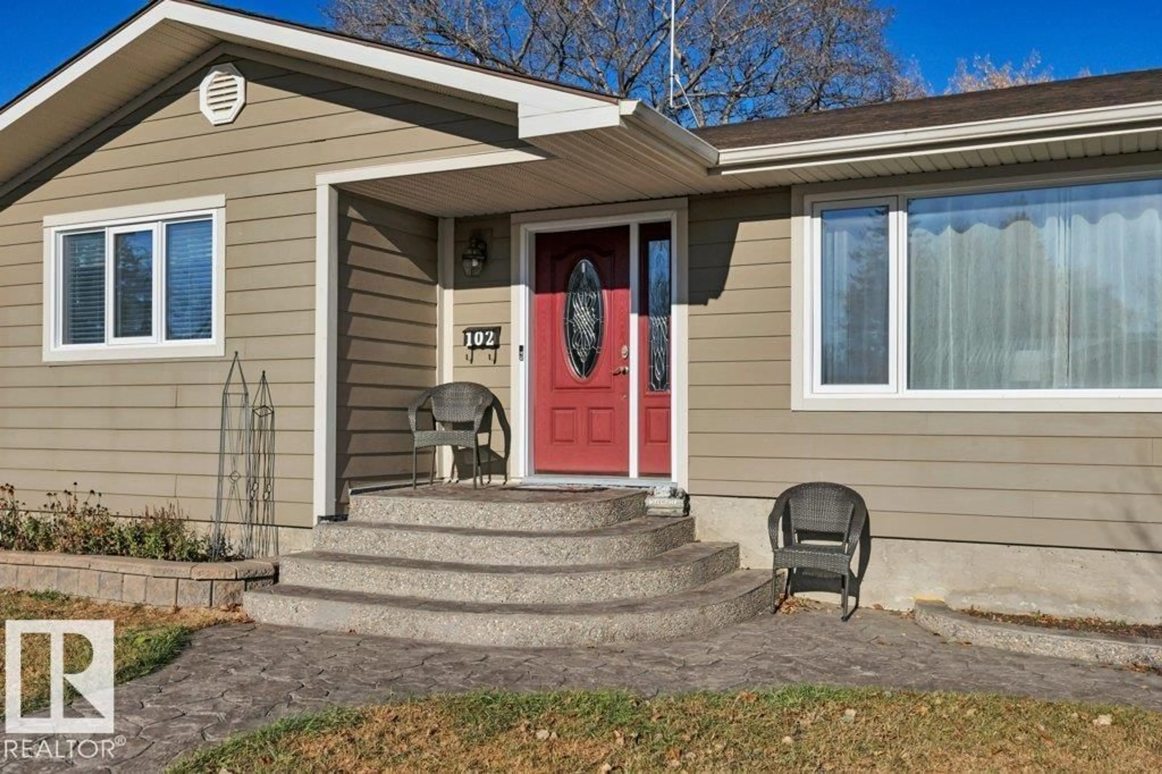Home with vinyl exterior material, street for 102 SPATINOW DR, Wetaskiwin Alberta T9A1W2