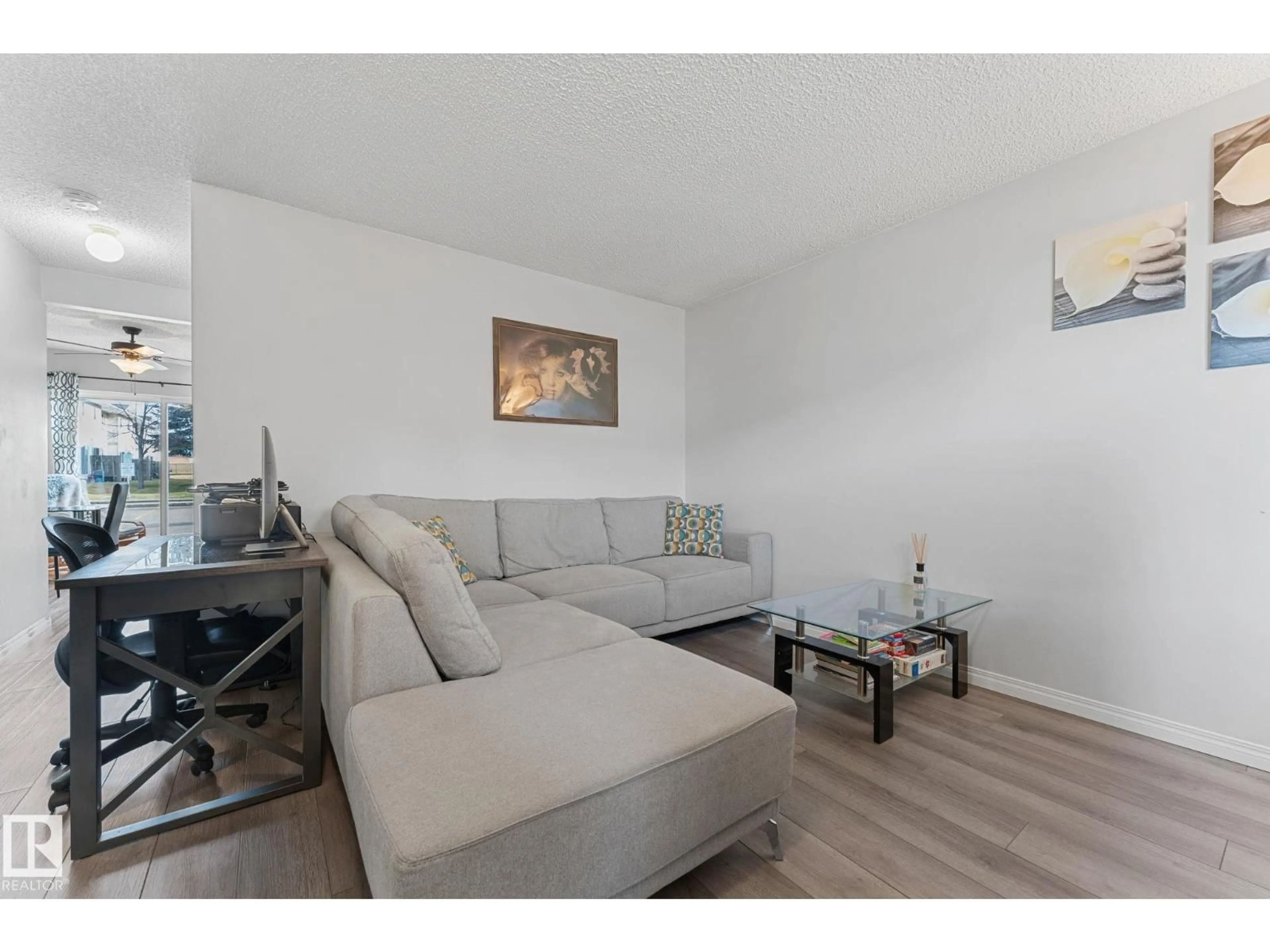 Living room with furniture, wood/laminate floor for 806 KING ST, Spruce Grove Alberta T7X4J9