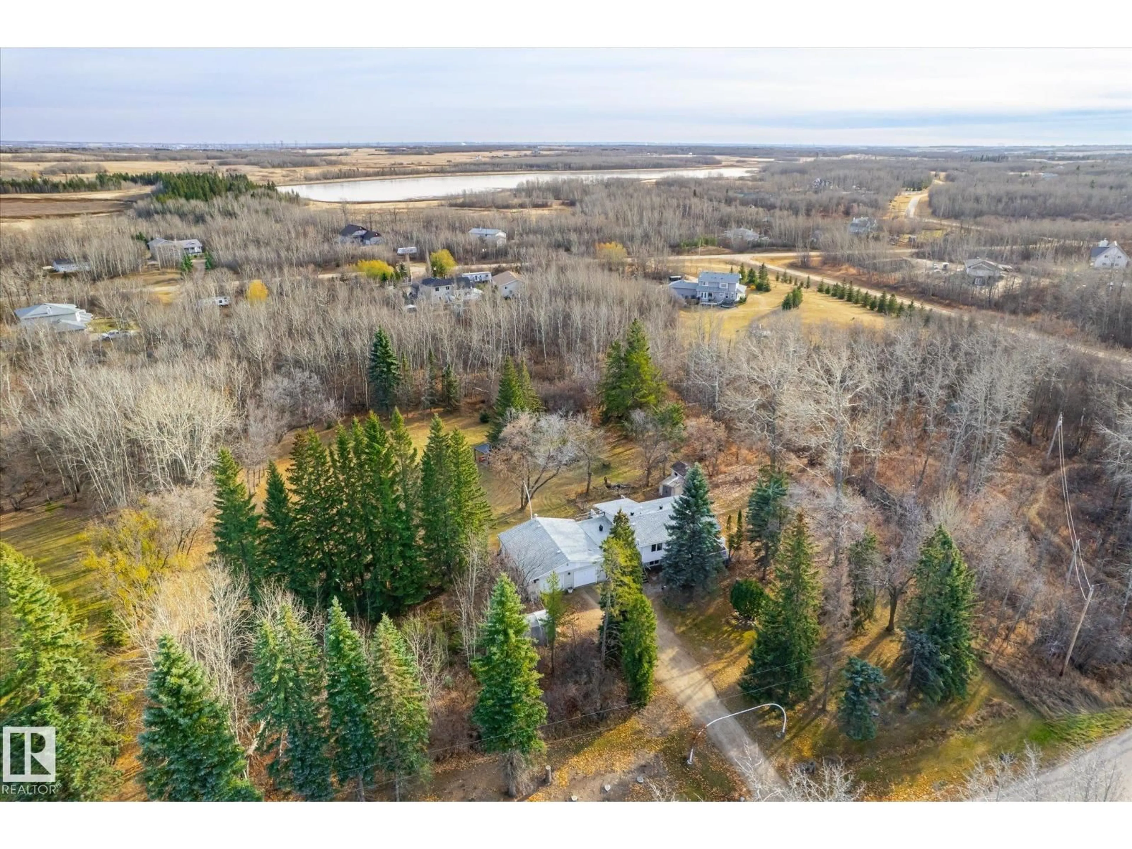 A pic from outside/outdoor area/front of a property/back of a property/a pic from drone, forest/trees view for 56513 RGE ROAD 230A, Rural Sturgeon County Alberta T0A1N5