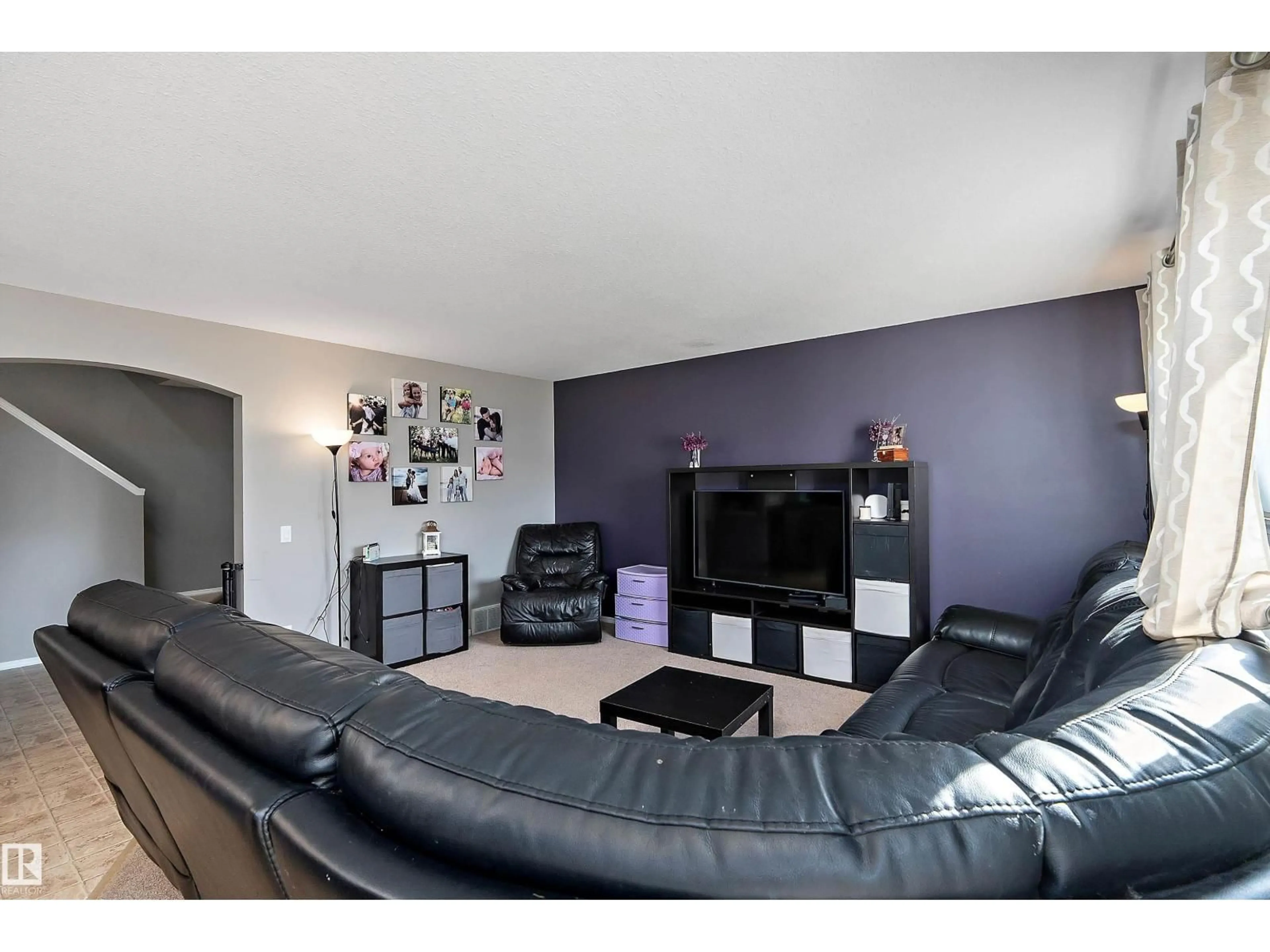 Living room with furniture, wood/laminate floor for 143 ACACIA CI, Leduc Alberta T9E0C9