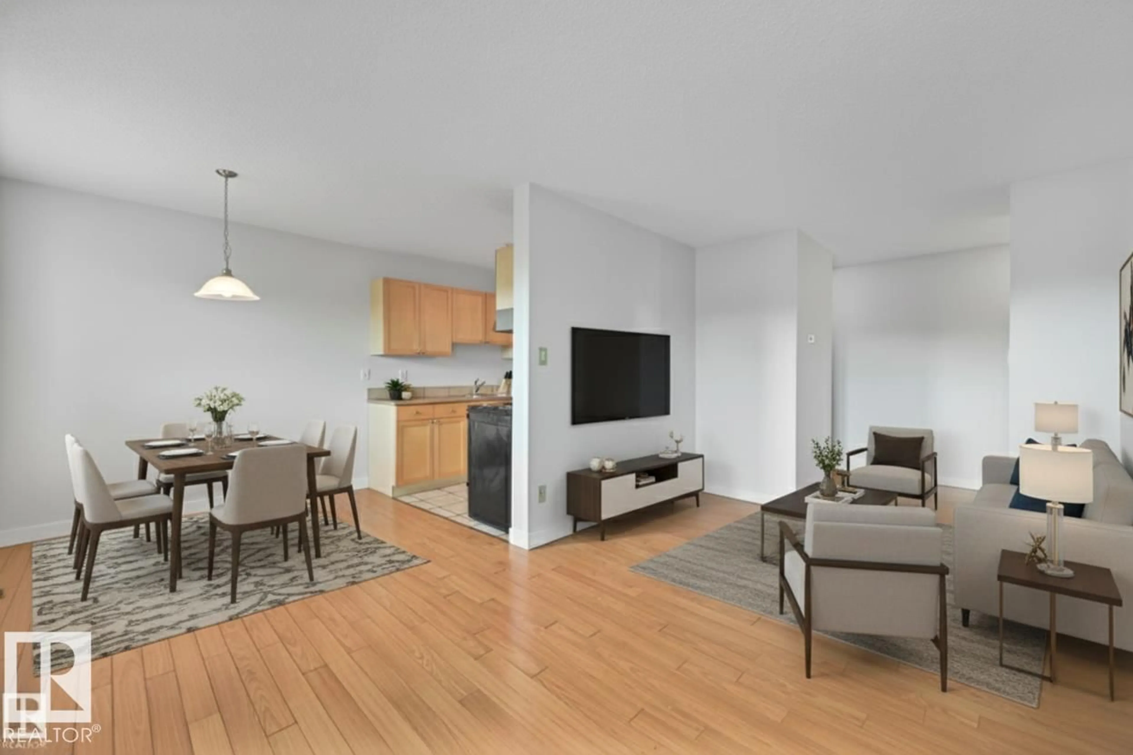 Living room with furniture, wood/laminate floor for 205 10917 109 ST NW, Edmonton Alberta T5H3C2