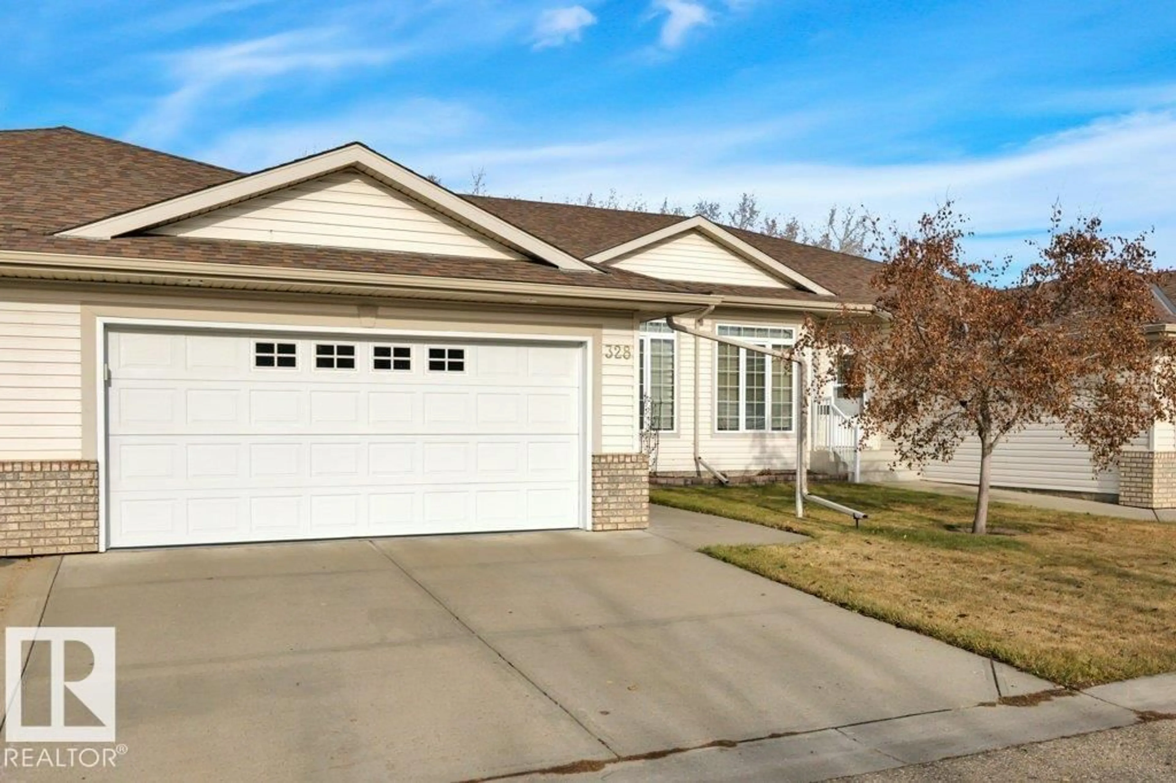 Home with vinyl exterior material, street for 328 RAVINE VI, Leduc Alberta T9E8H3