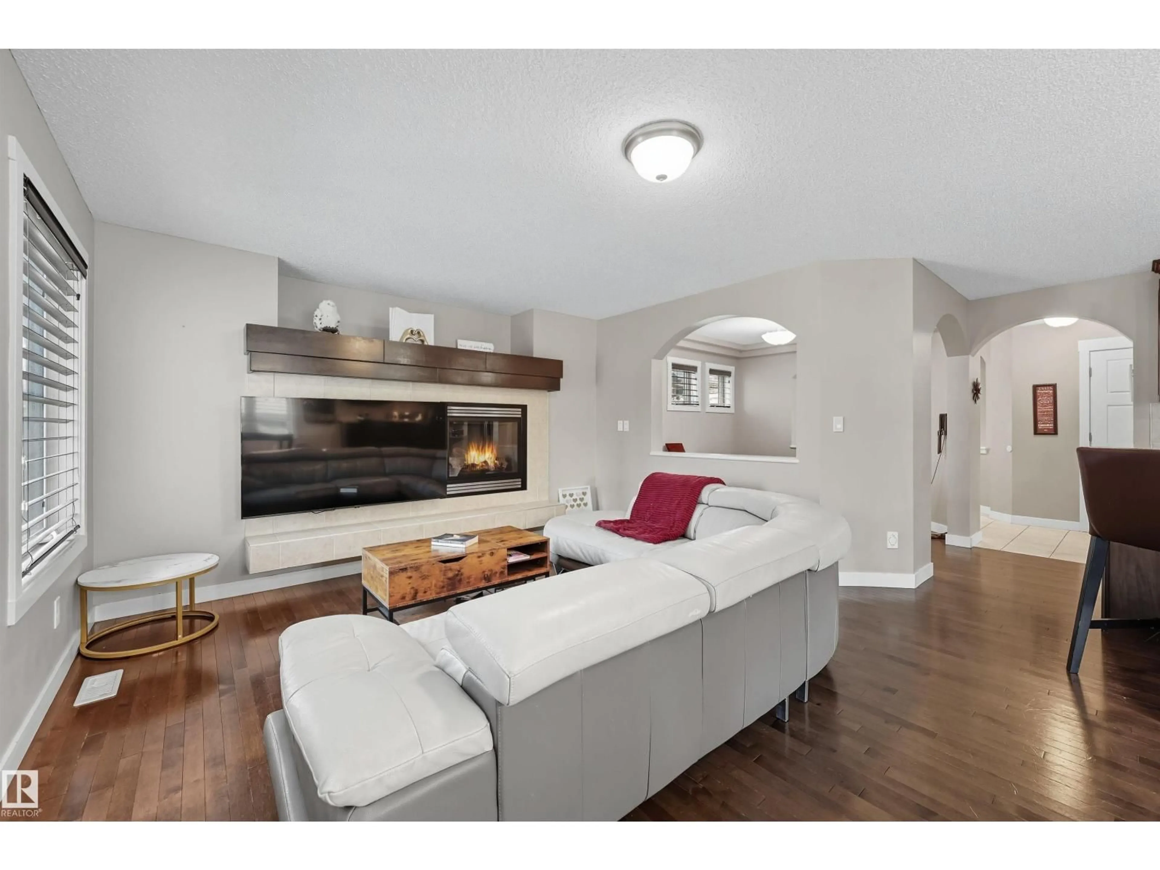 Living room with furniture, wood/laminate floor for 2608 ANDERSON CR, Edmonton Alberta T6W0K9