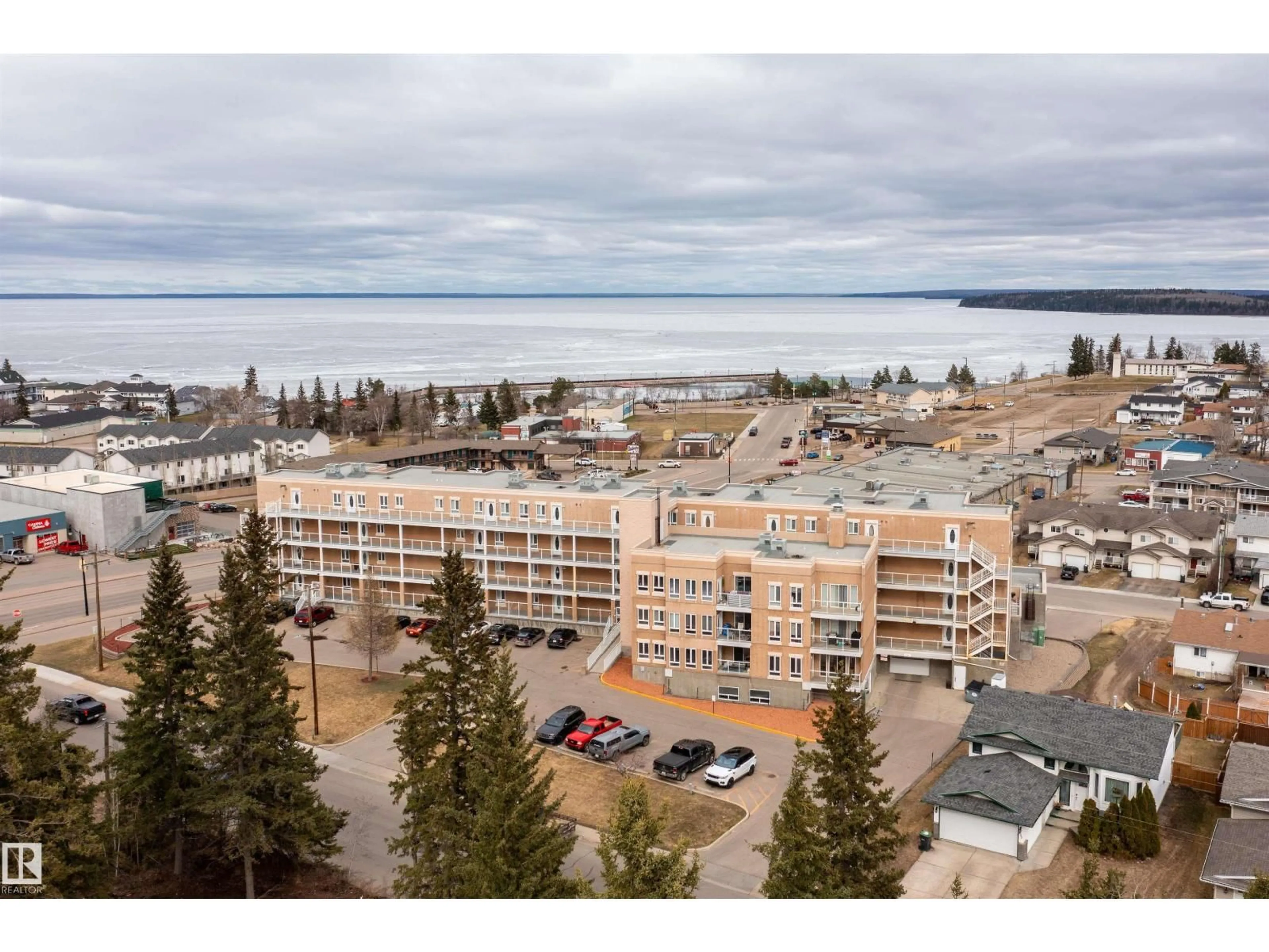 A pic from outside/outdoor area/front of a property/back of a property/a pic from drone, water/lake/river/ocean view for 409 802 12 ST, Cold Lake Alberta T9M0A7