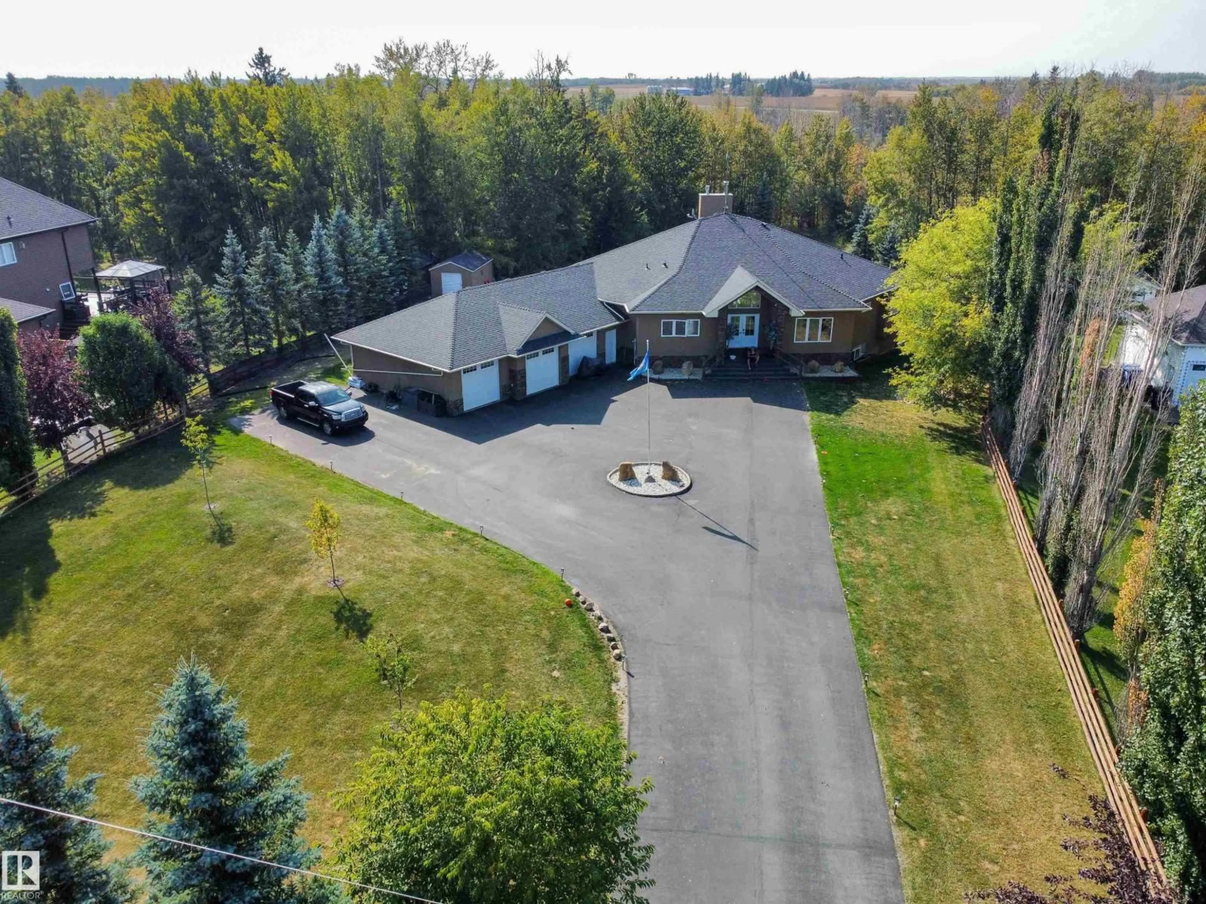 A pic from outside/outdoor area/front of a property/back of a property/a pic from drone, unknown for #14 - 52001 RGE ROAD 275, Rural Parkland County Alberta T7X3V2