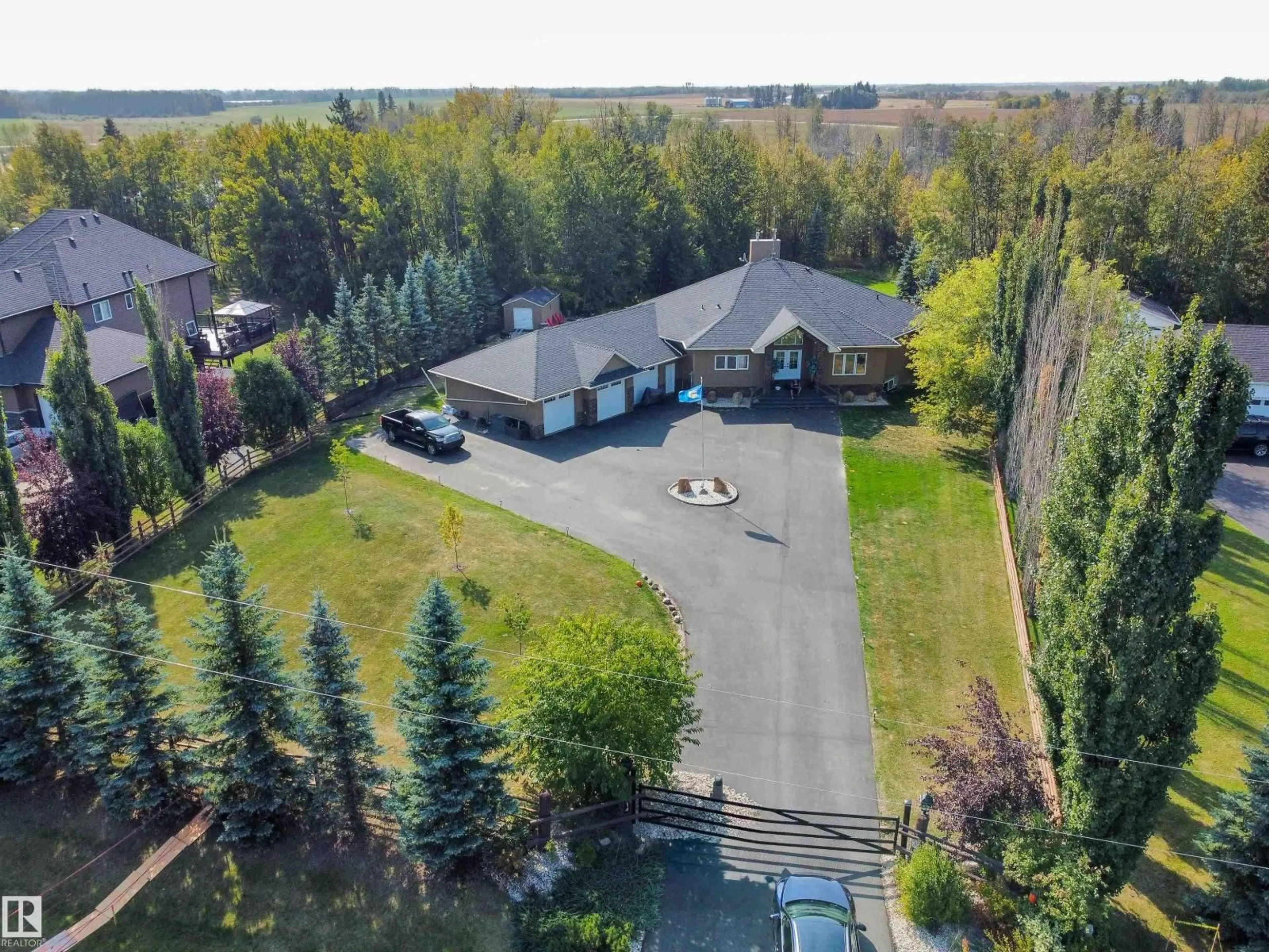 A pic from outside/outdoor area/front of a property/back of a property/a pic from drone, unknown for #14 - 52001 RGE ROAD 275, Rural Parkland County Alberta T7X3V2