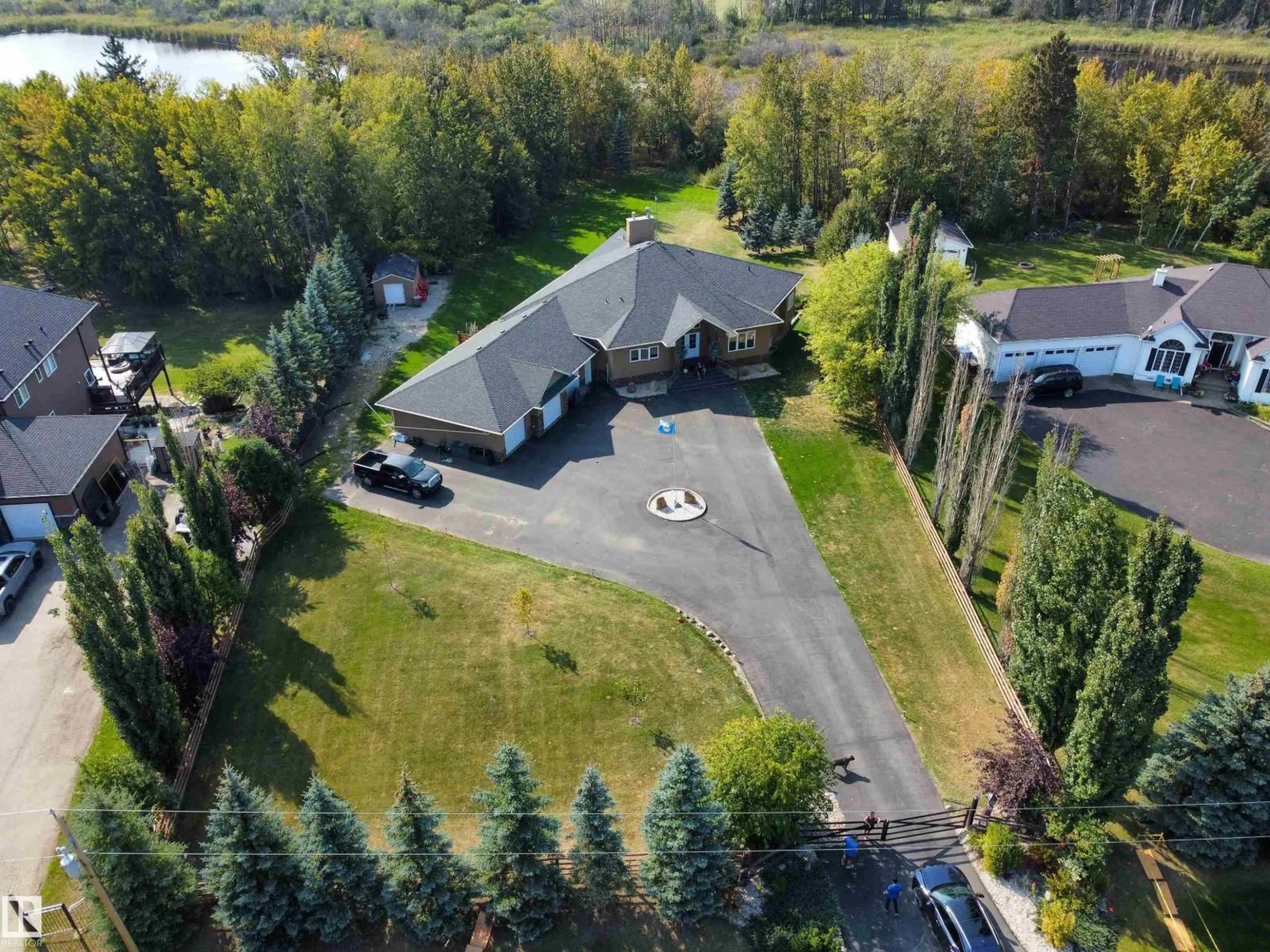 A pic from outside/outdoor area/front of a property/back of a property/a pic from drone, unknown for #14 - 52001 RGE ROAD 275, Rural Parkland County Alberta T7X3V2
