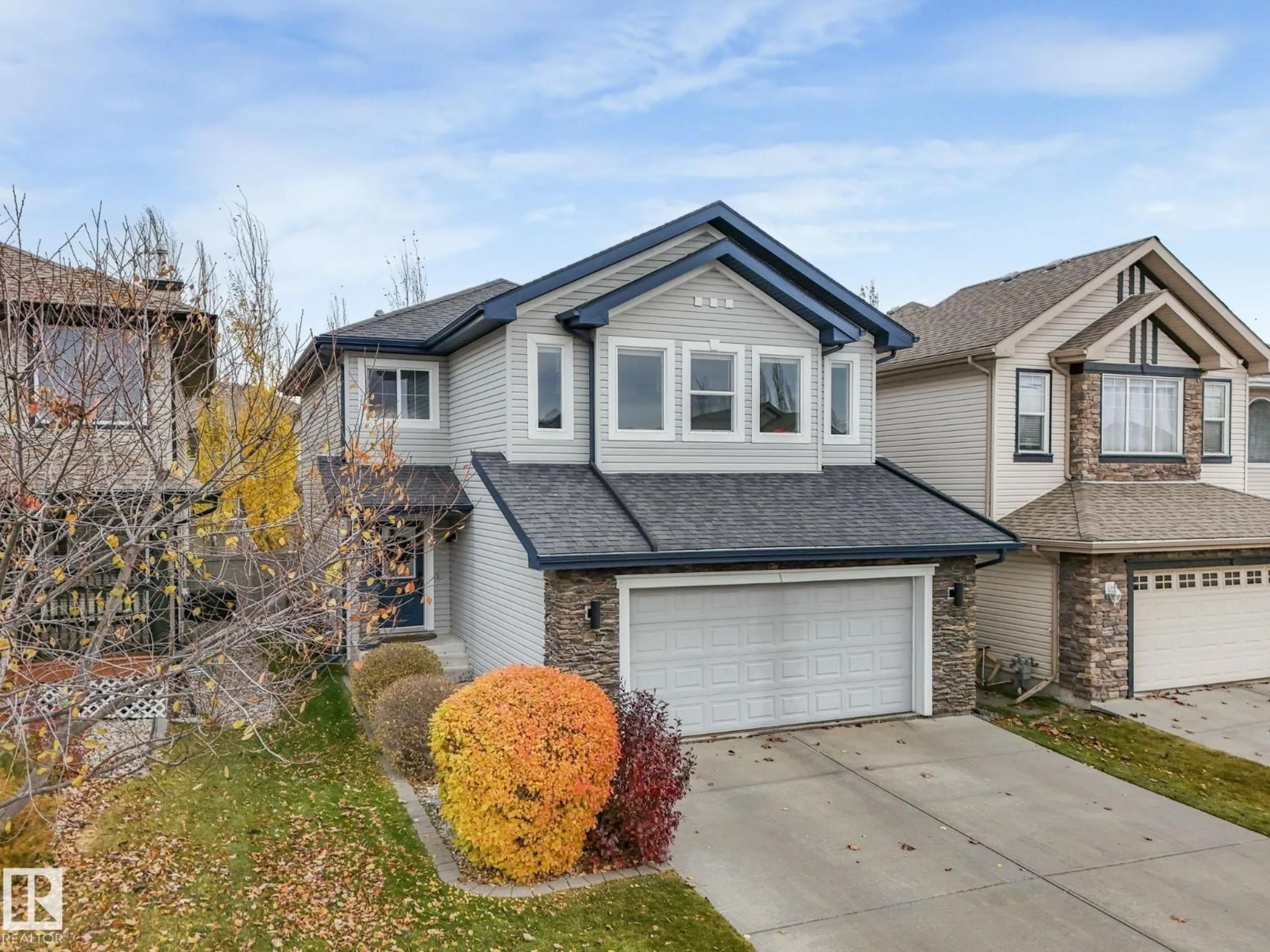 Home with vinyl exterior material, street for 6913 STROM LN, Edmonton Alberta T6R0G3