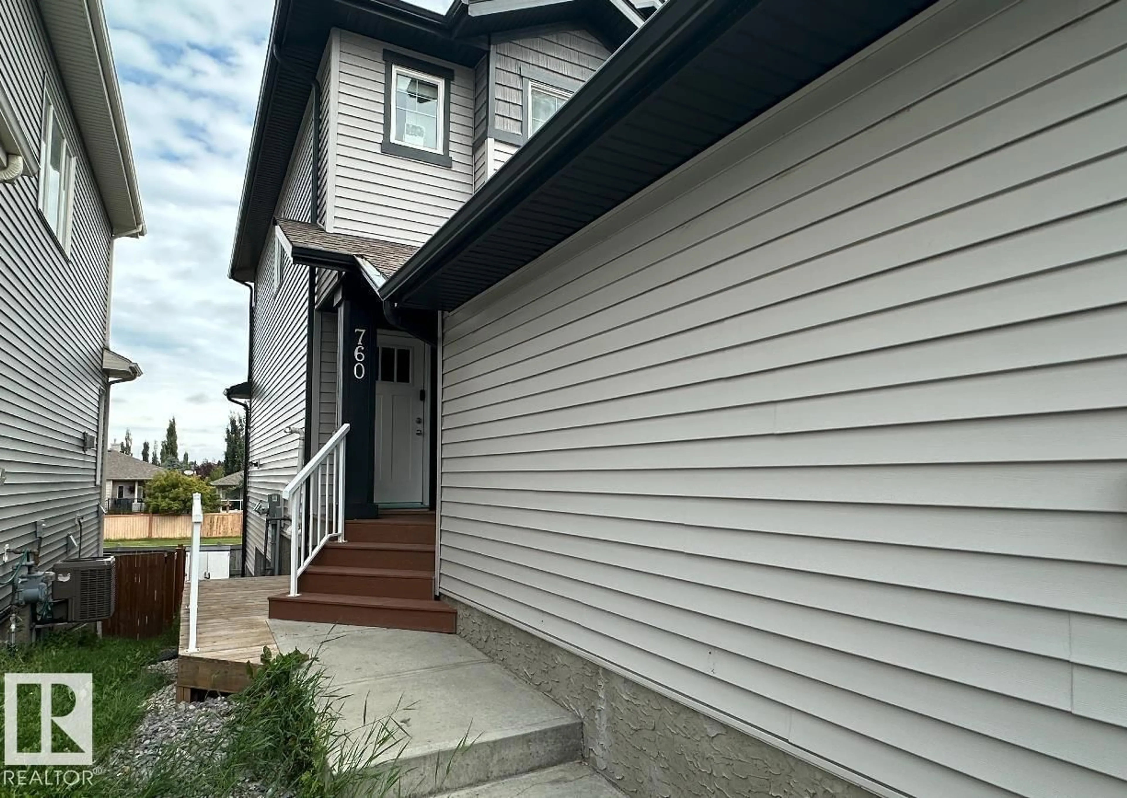 Home with vinyl exterior material, street for 760 BERG LO, Leduc Alberta T9E1G8