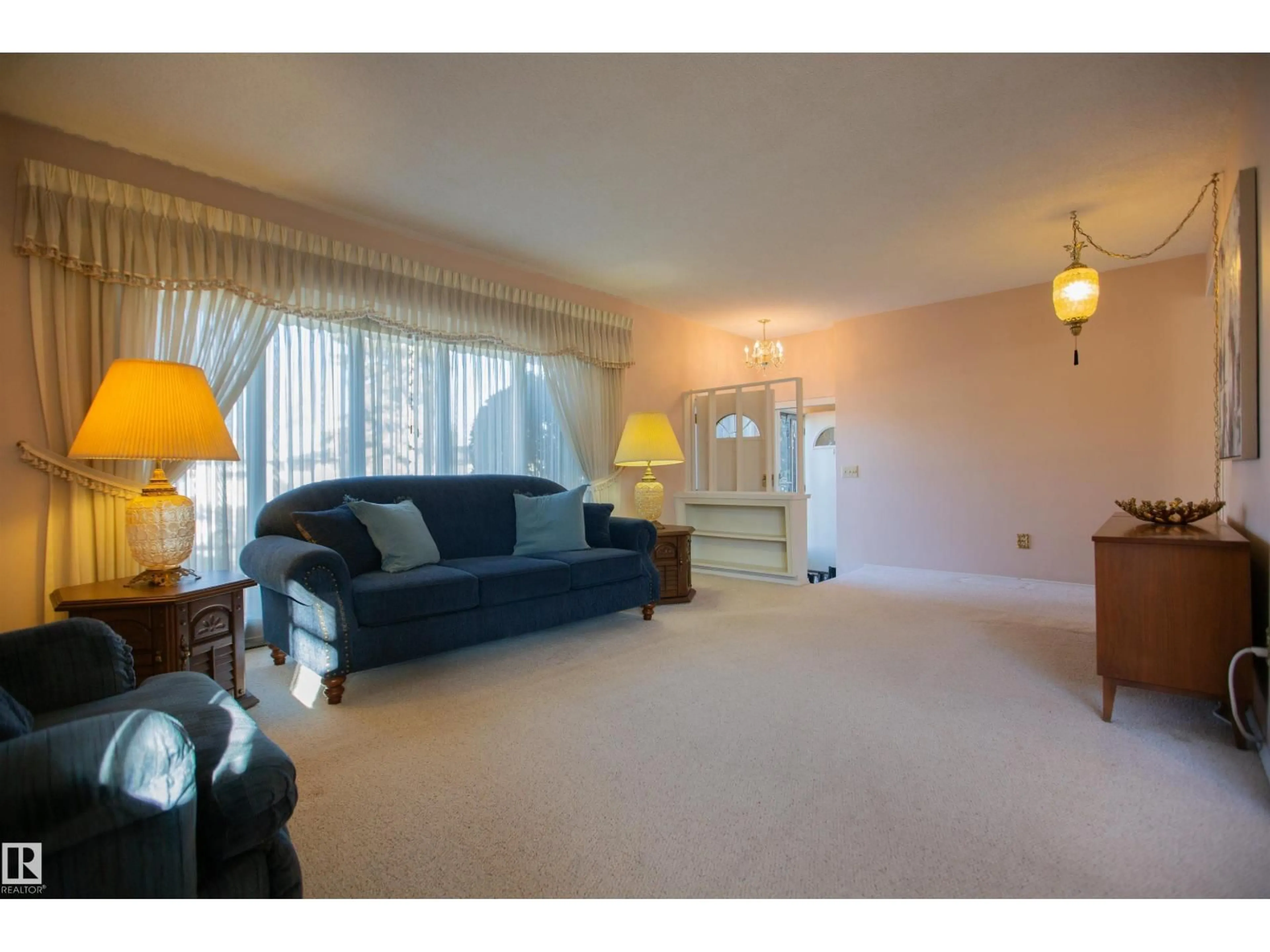 Living room with furniture, carpet floor for 5603 92 AV, Edmonton Alberta T6B0S2