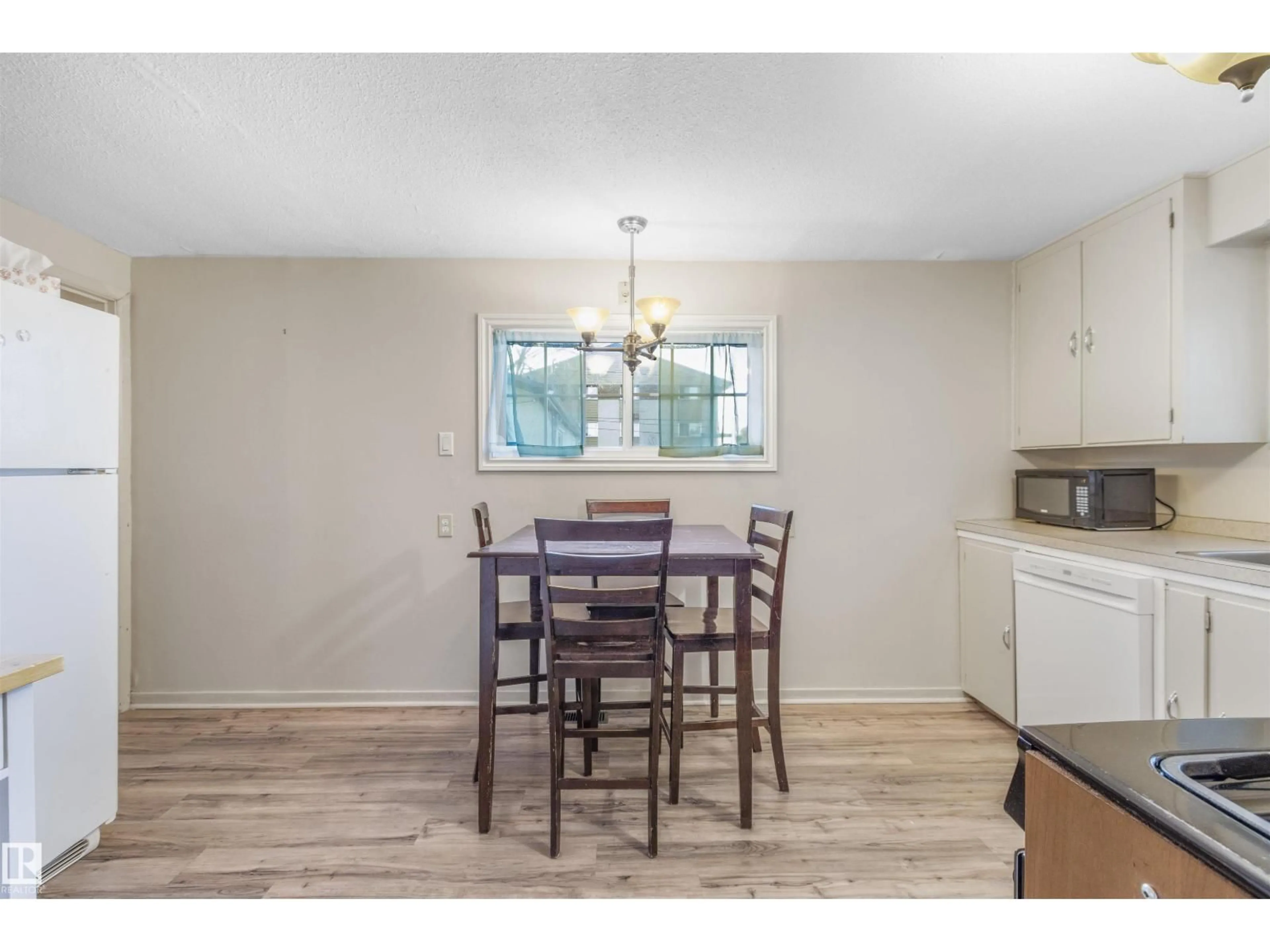 Dining room, wood/laminate floor for 4804 49 AV, Drayton Valley Alberta T7A1J3