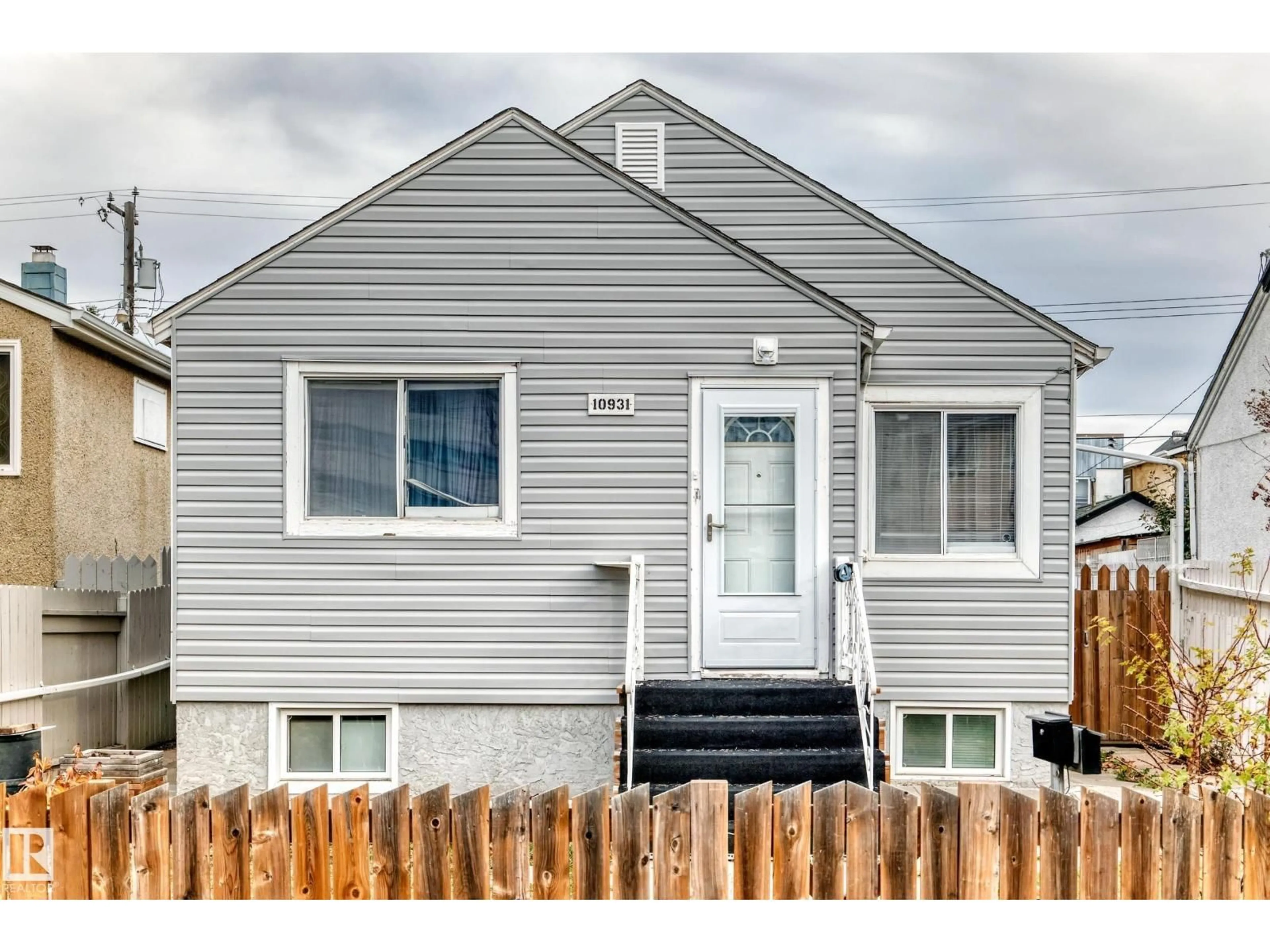 Home with vinyl exterior material, street for NW - 10931 98 ST, Edmonton Alberta T5H2P7