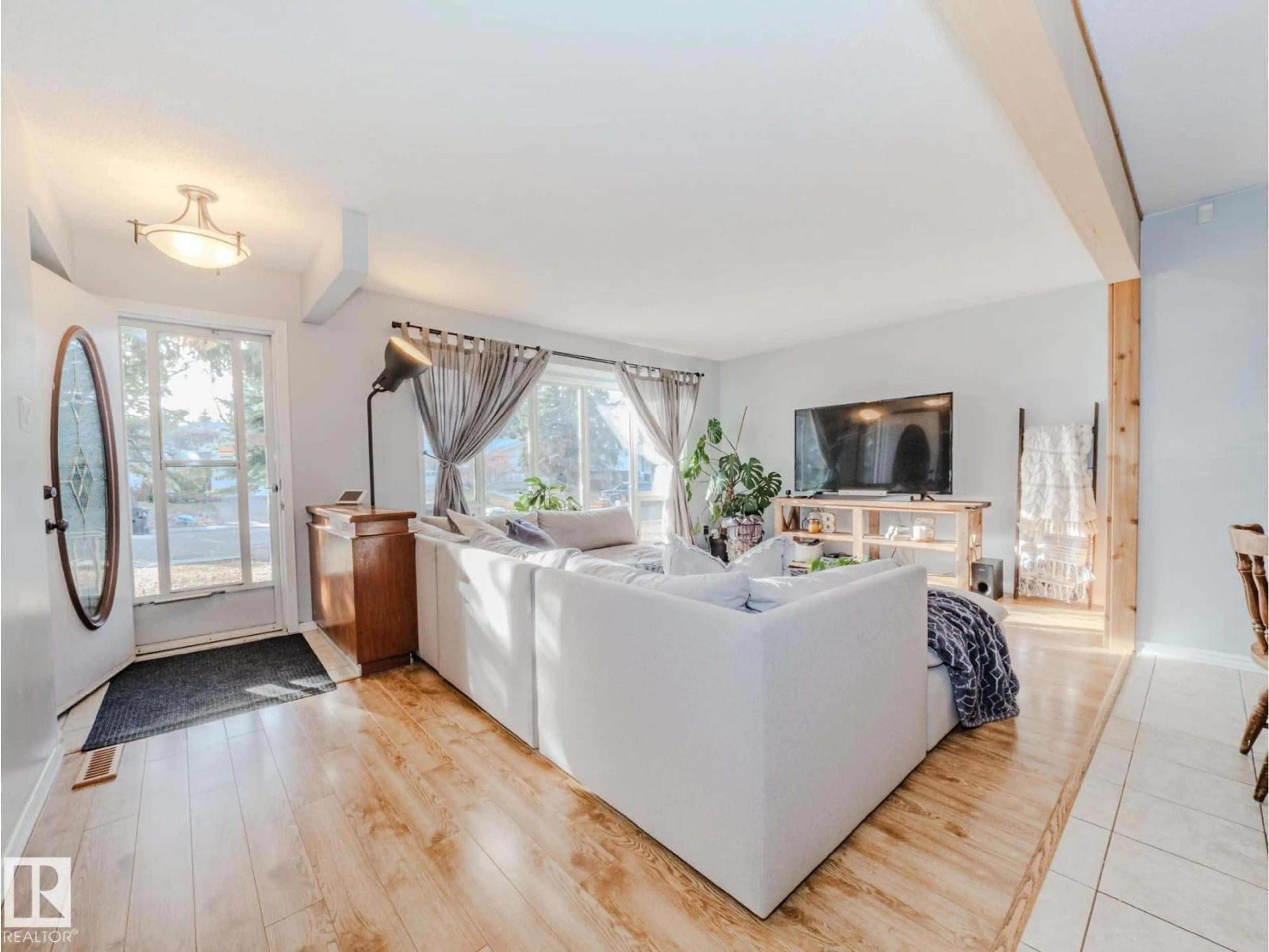 Living room with furniture, wood/laminate floor for 97 MARION DR, Sherwood Park Alberta T8A2G8