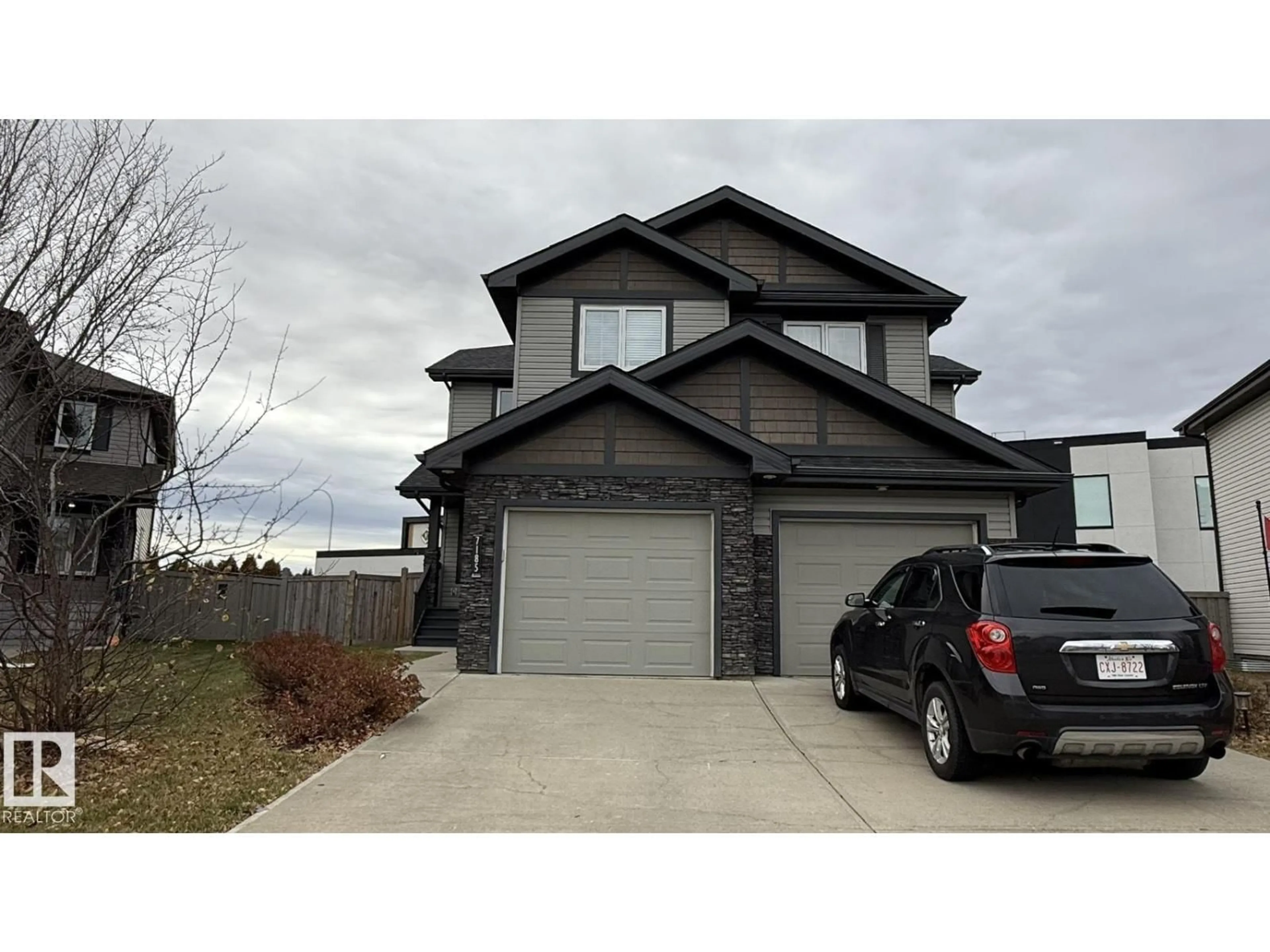 Home with vinyl exterior material, street for 7185 CARDINAL WY, Edmonton Alberta T6W2Y3