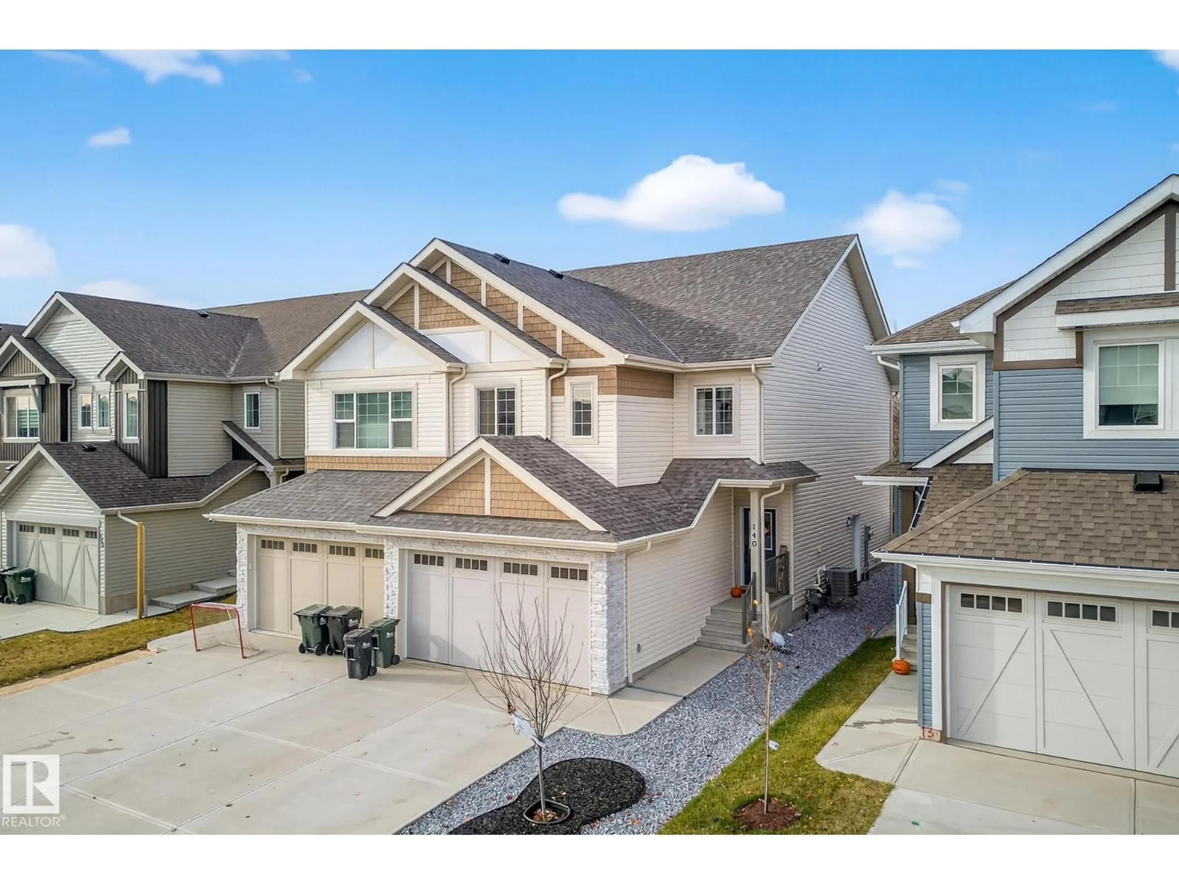 A pic from outside/outdoor area/front of a property/back of a property/a pic from drone, street for 140 RANCHER RD, Ardrossan Alberta T8E0A7