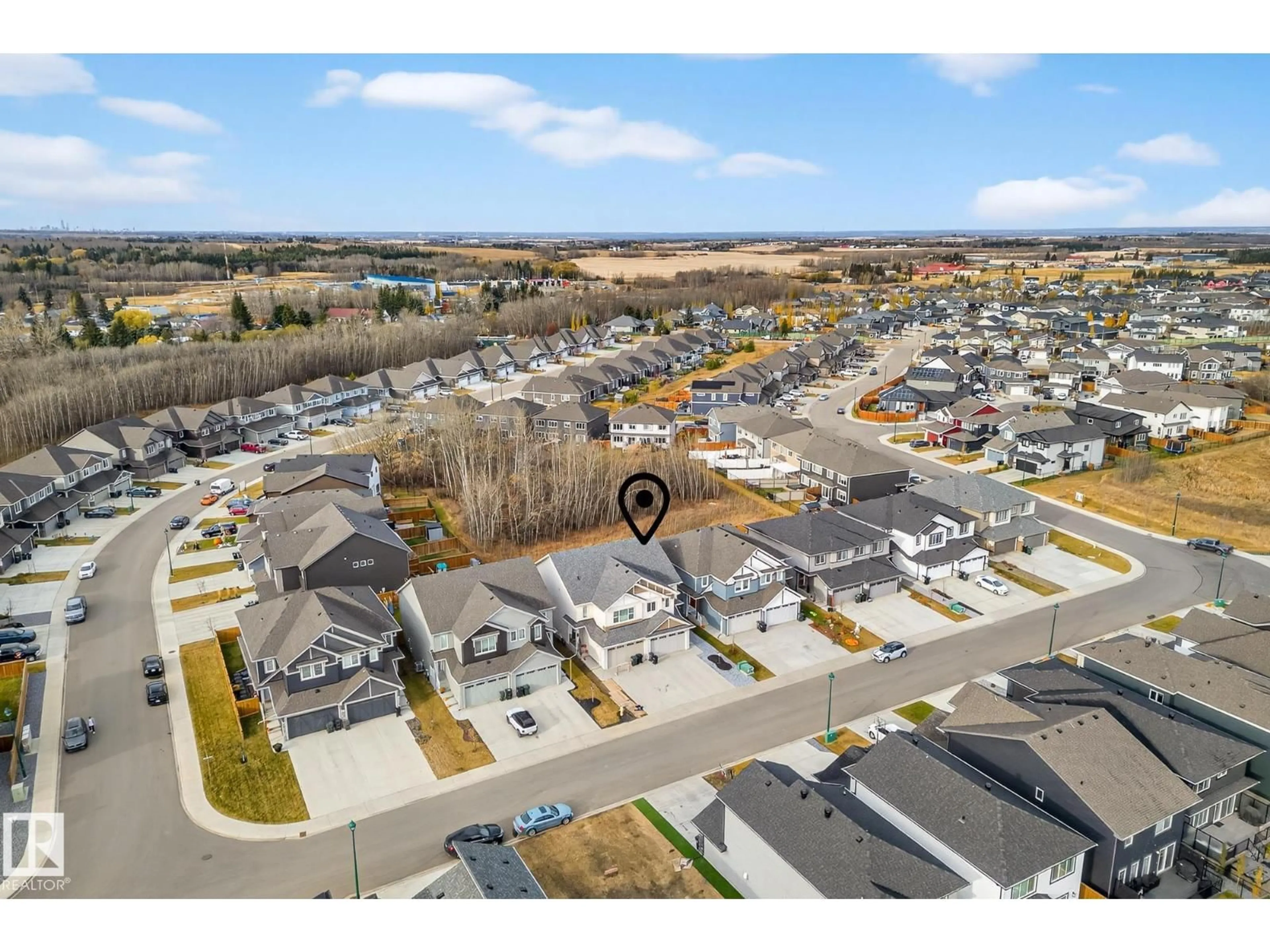 A pic from outside/outdoor area/front of a property/back of a property/a pic from drone, street for 140 RANCHER RD, Ardrossan Alberta T8E0A7