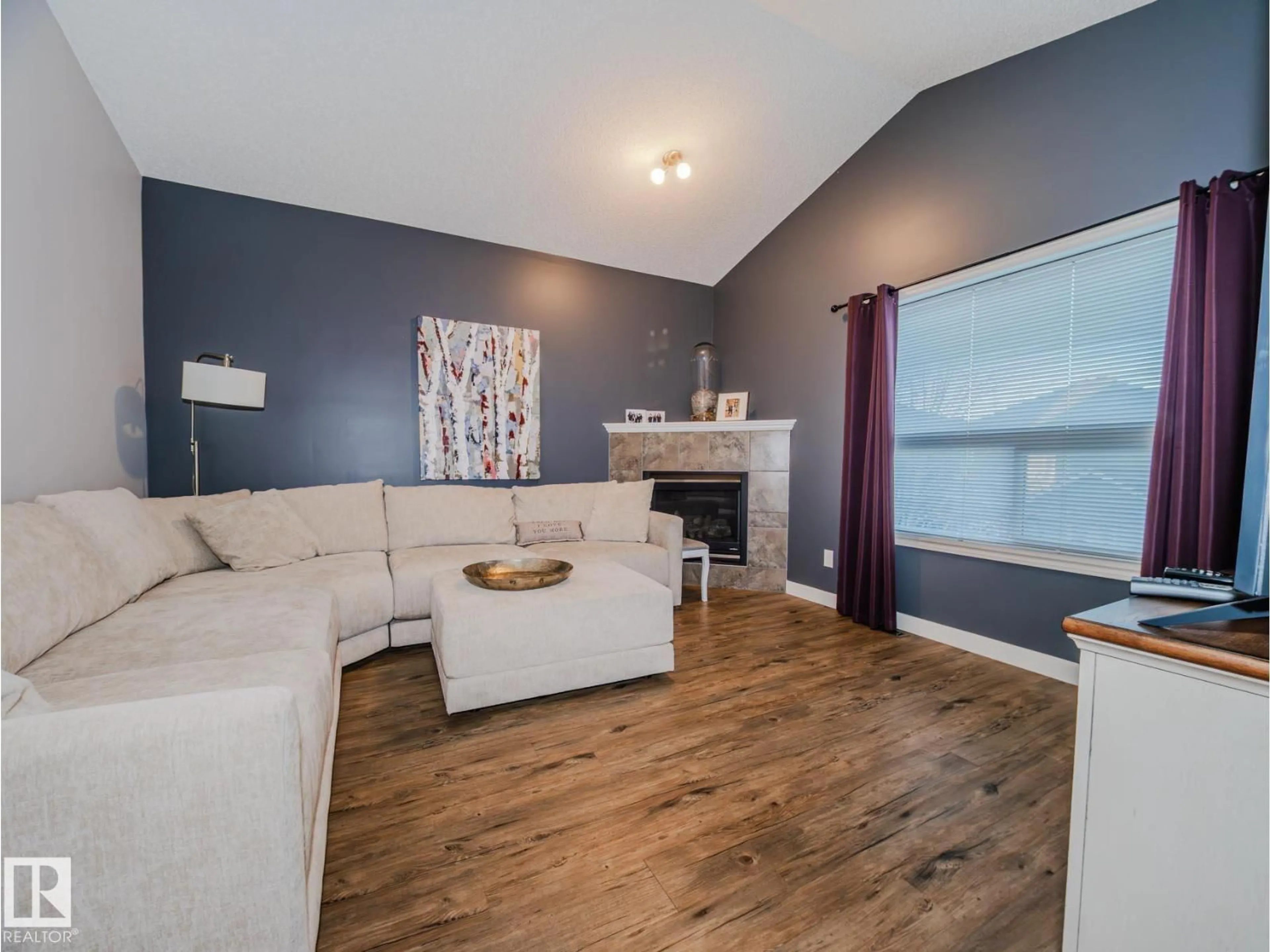 Living room with furniture, wood/laminate floor for 236 ASCOTT CR, Sherwood Park Alberta T8H0A6