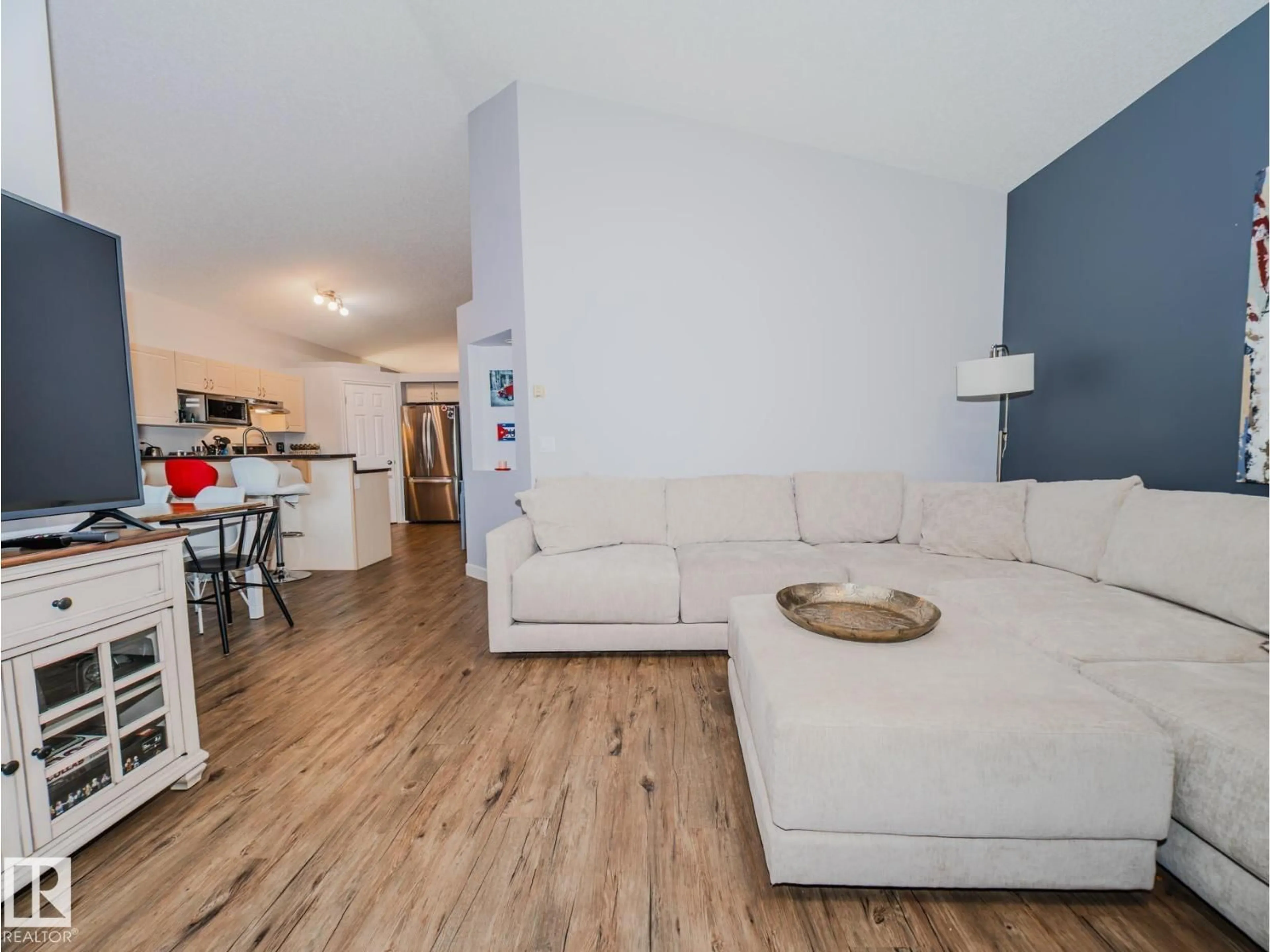 Living room with furniture, wood/laminate floor for 236 ASCOTT CR, Sherwood Park Alberta T8H0A6