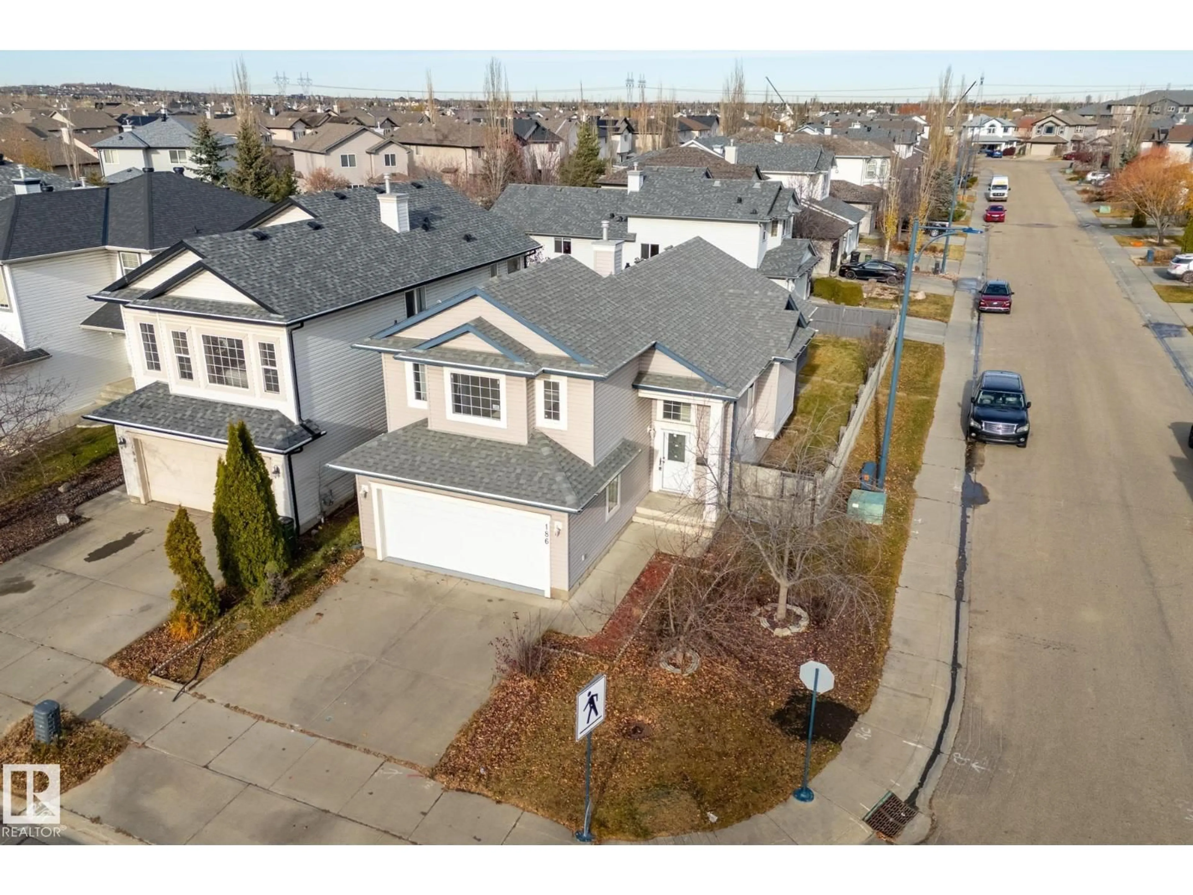 A pic from outside/outdoor area/front of a property/back of a property/a pic from drone, street for 186 MACEWAN RD, Edmonton Alberta T6W1K8