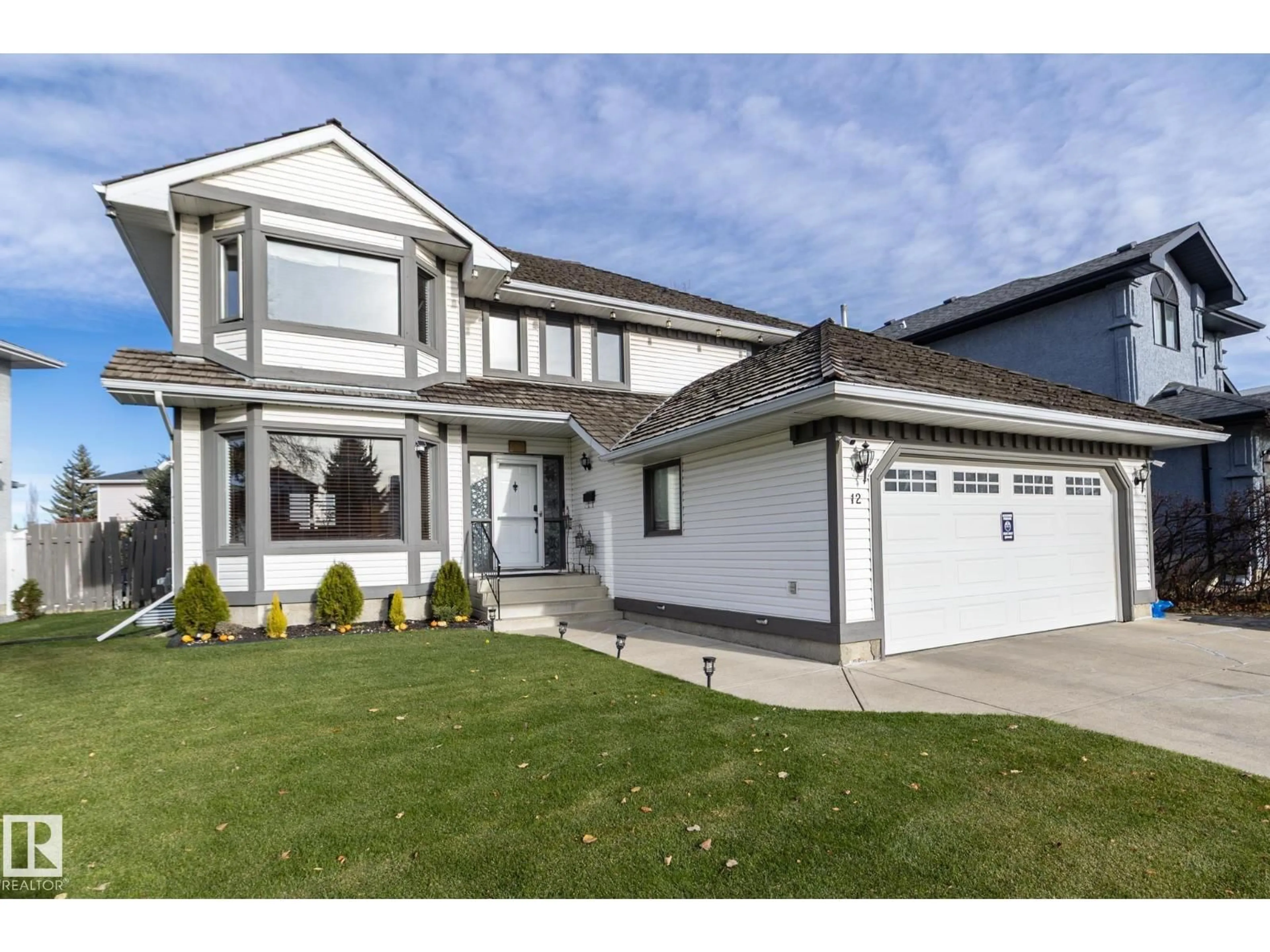 Home with vinyl exterior material, street for 12 ELSINORE PL, Edmonton Alberta T5X5W3