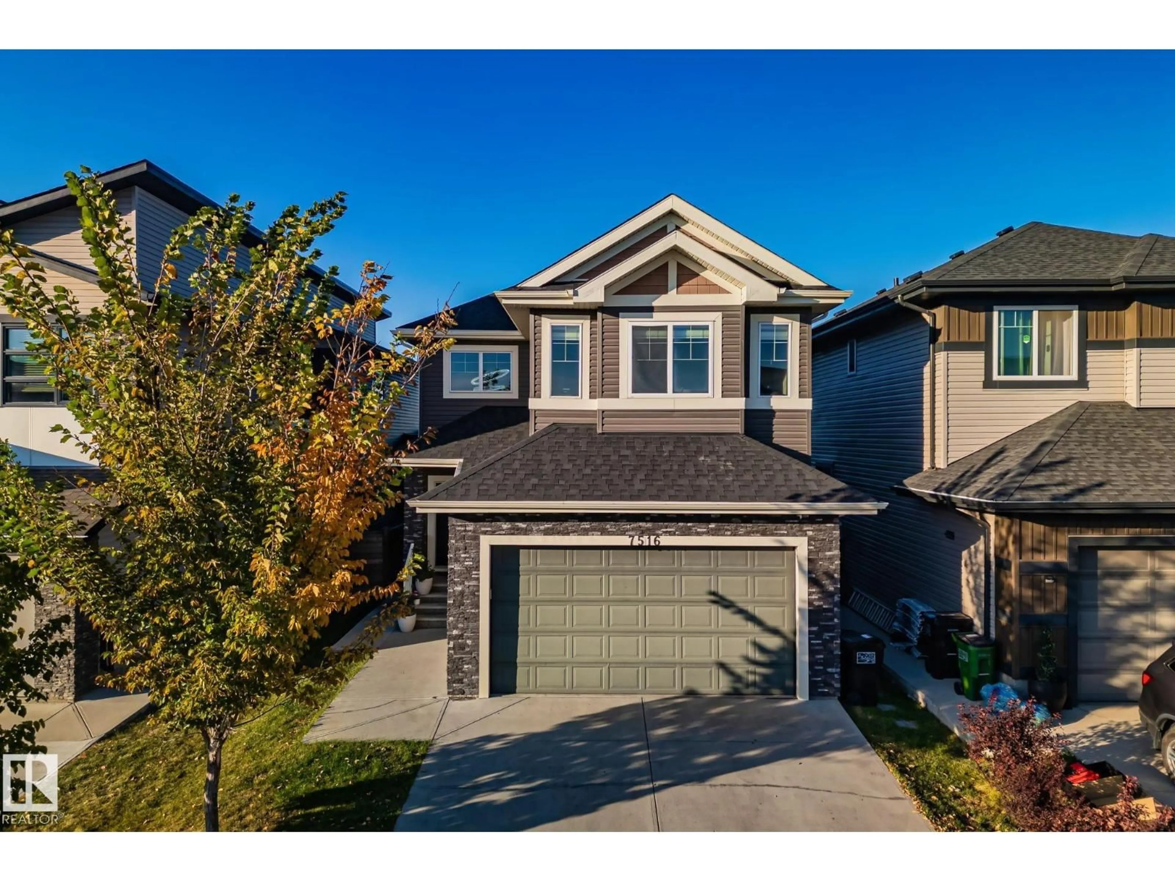 Home with brick exterior material, street for NW - 7516 182 AV, Edmonton Alberta T5Z0M1