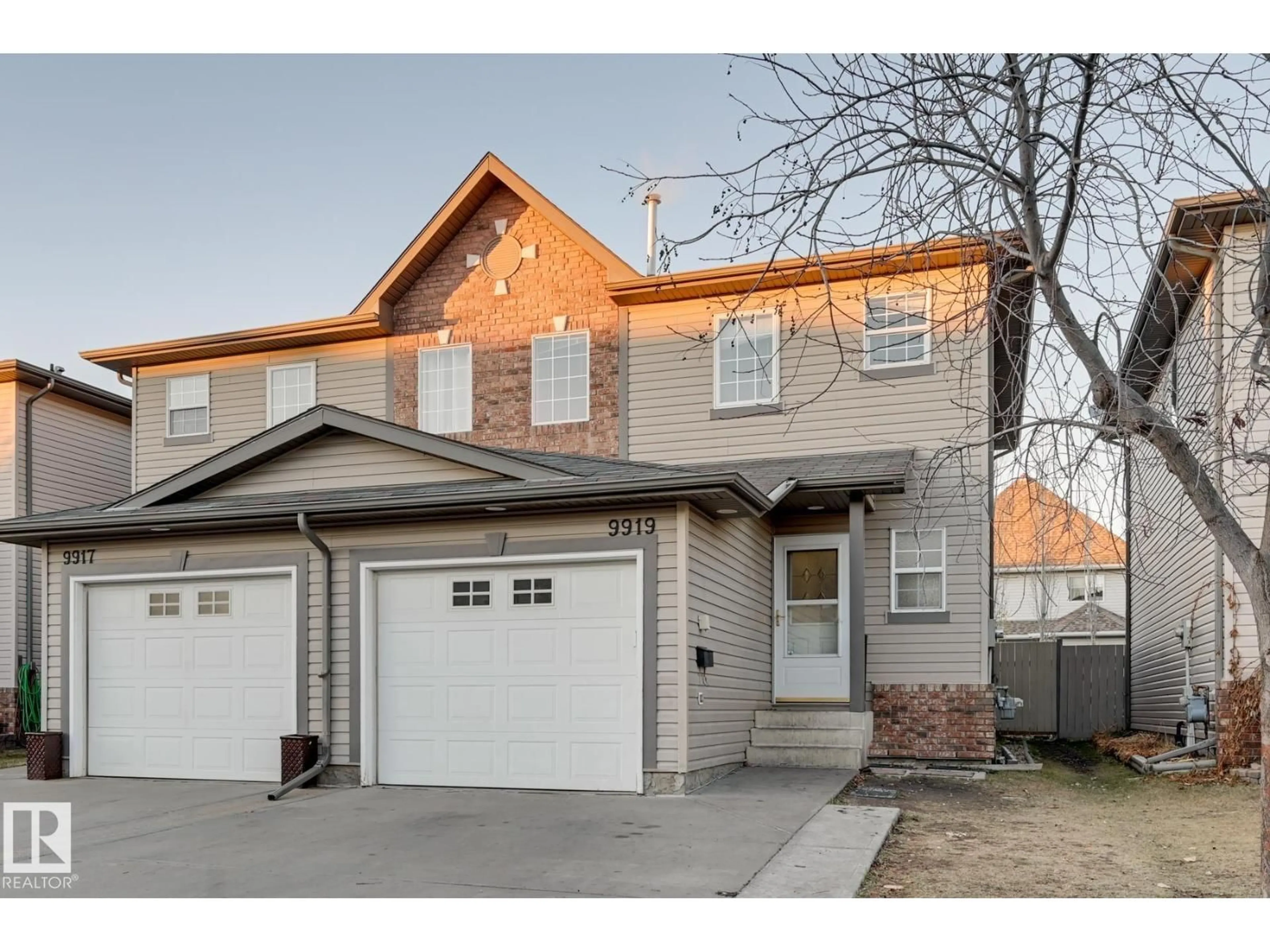 Home with vinyl exterior material, street for 9919 102, Morinville Alberta T8R1V9